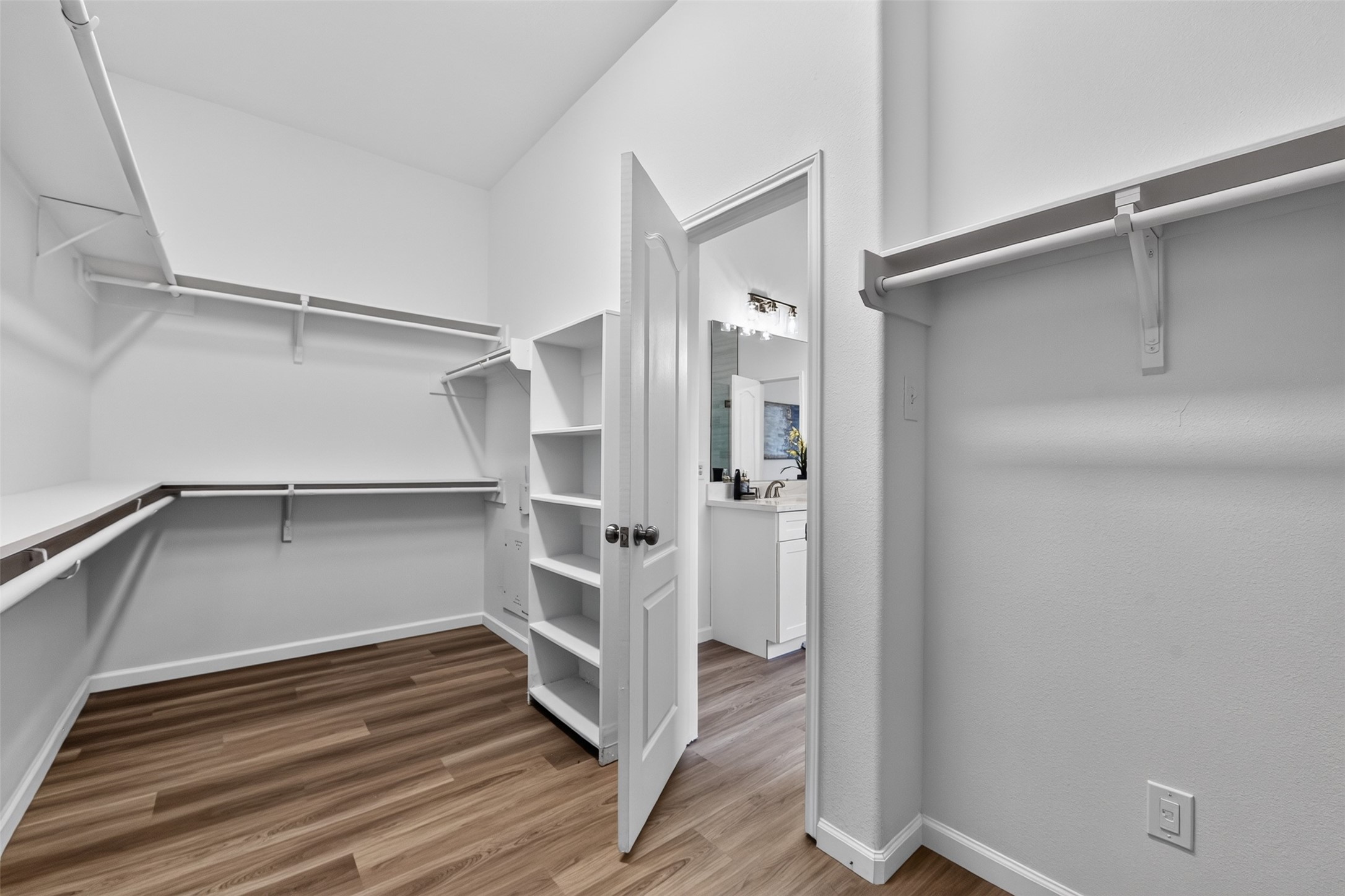 Wow! Look at this wonderful walk-in closet! Built-in shelving and plenty of space for hanging clothing, etc.