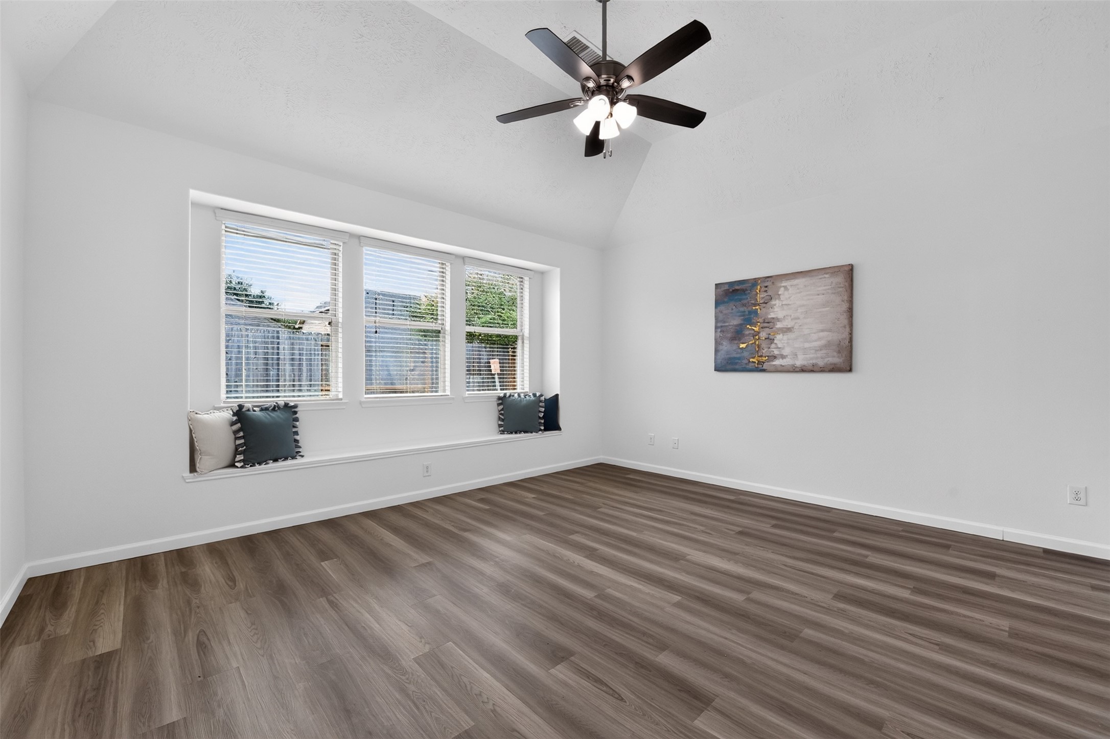 The primary bedroom also has an elevated ceiling with new ceiling fan.
