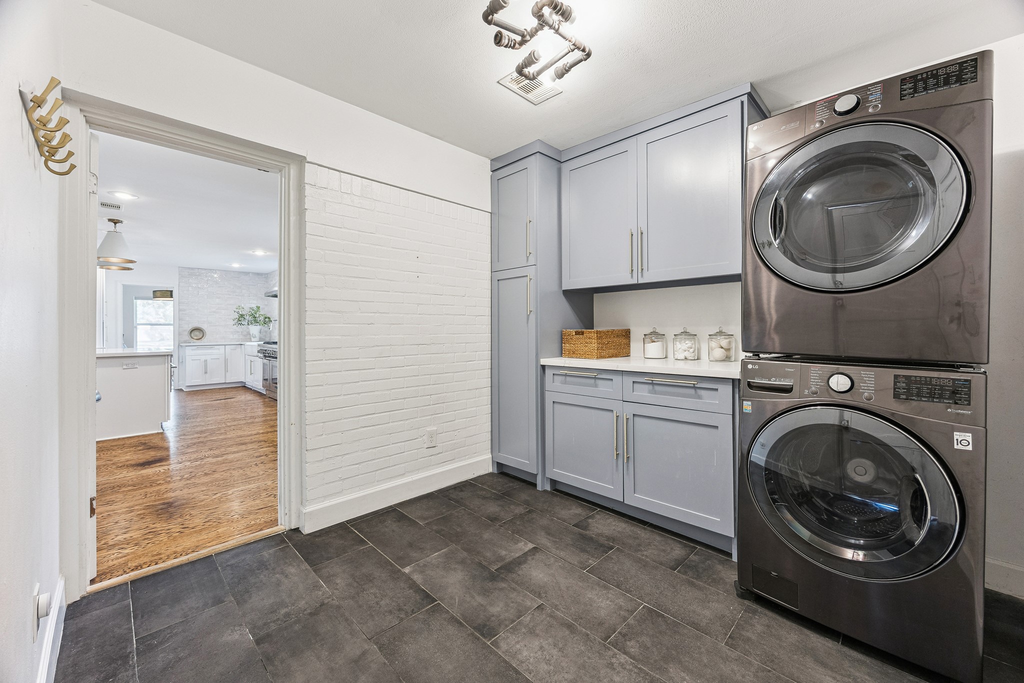 With custom cabinetry added in 2023, the laundry room boasts plenty of space and storage options readily available. Even this functional space reflects
the home's attention to detail. (Washer and Dryer excluded).