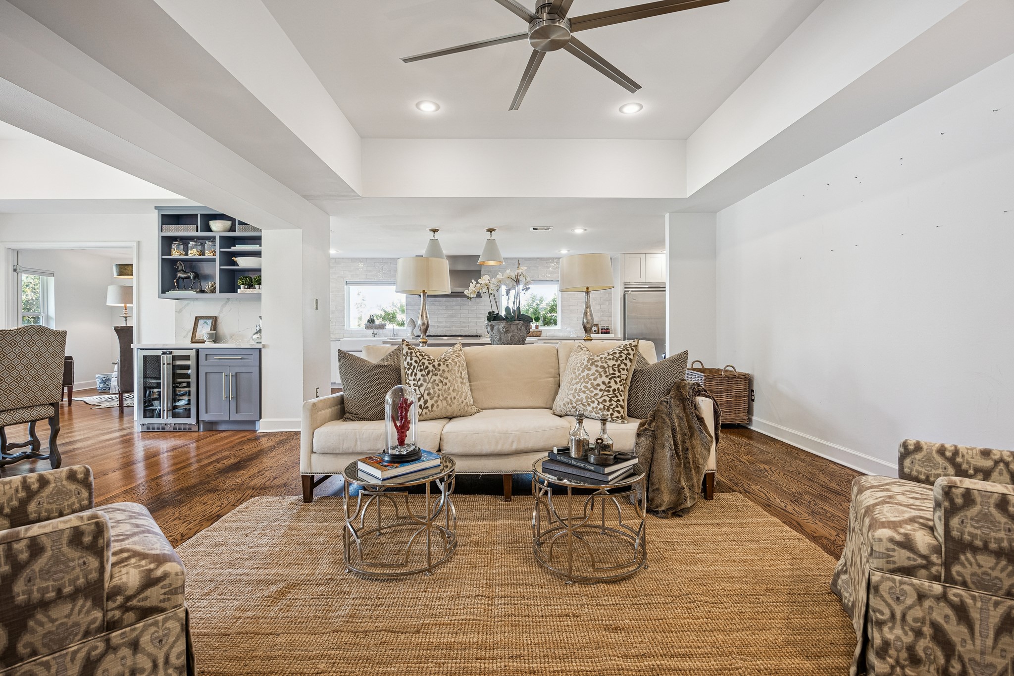 Designed for comfortable everyday living, this open-concept space offers plenty of room to gather with family and friends. Its seamless connection to the dining room and kitchen makes entertaining effortless.