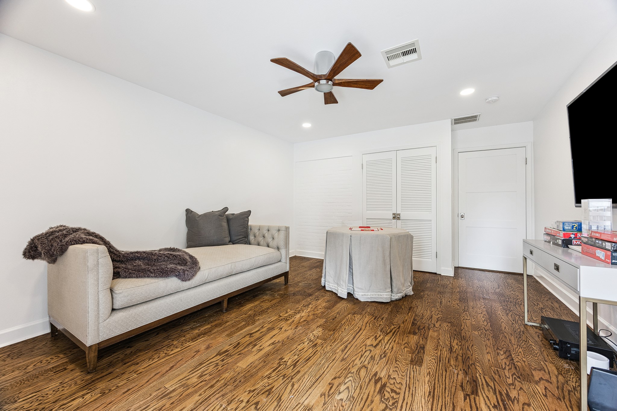 (22x9) This bedroom is bathed in natural light
courtesy of French doors that frame the far wall.
The space offers a serene retreat, thoughtfully finished for comfort and style.