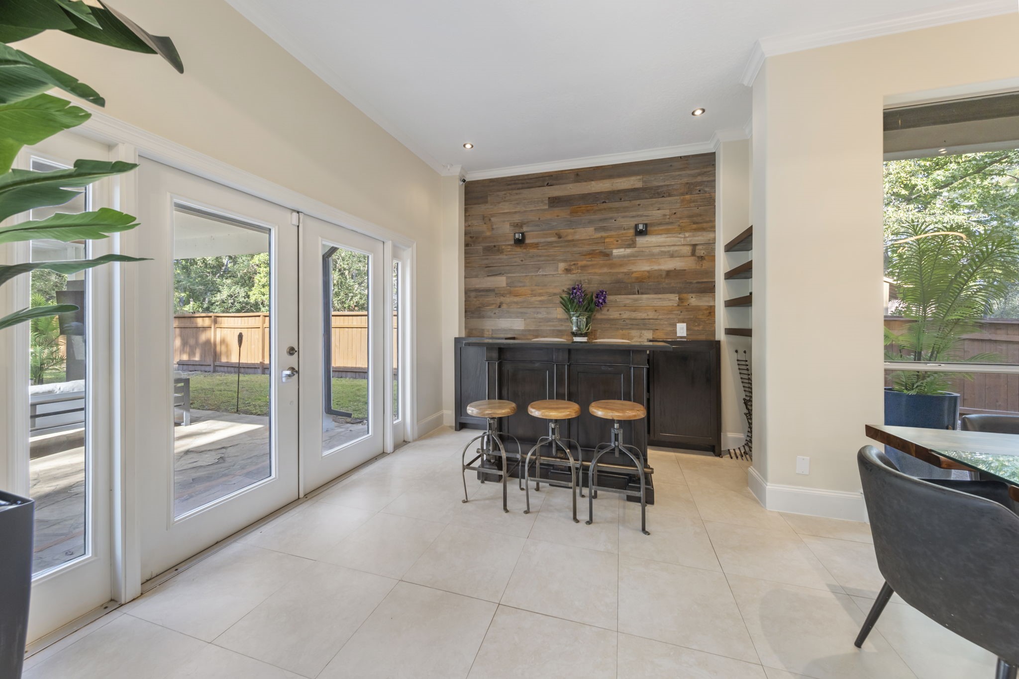 Dry bar set up at backyard entry creates an easy indoor/outdoor entertainment area to enjoy all year round.