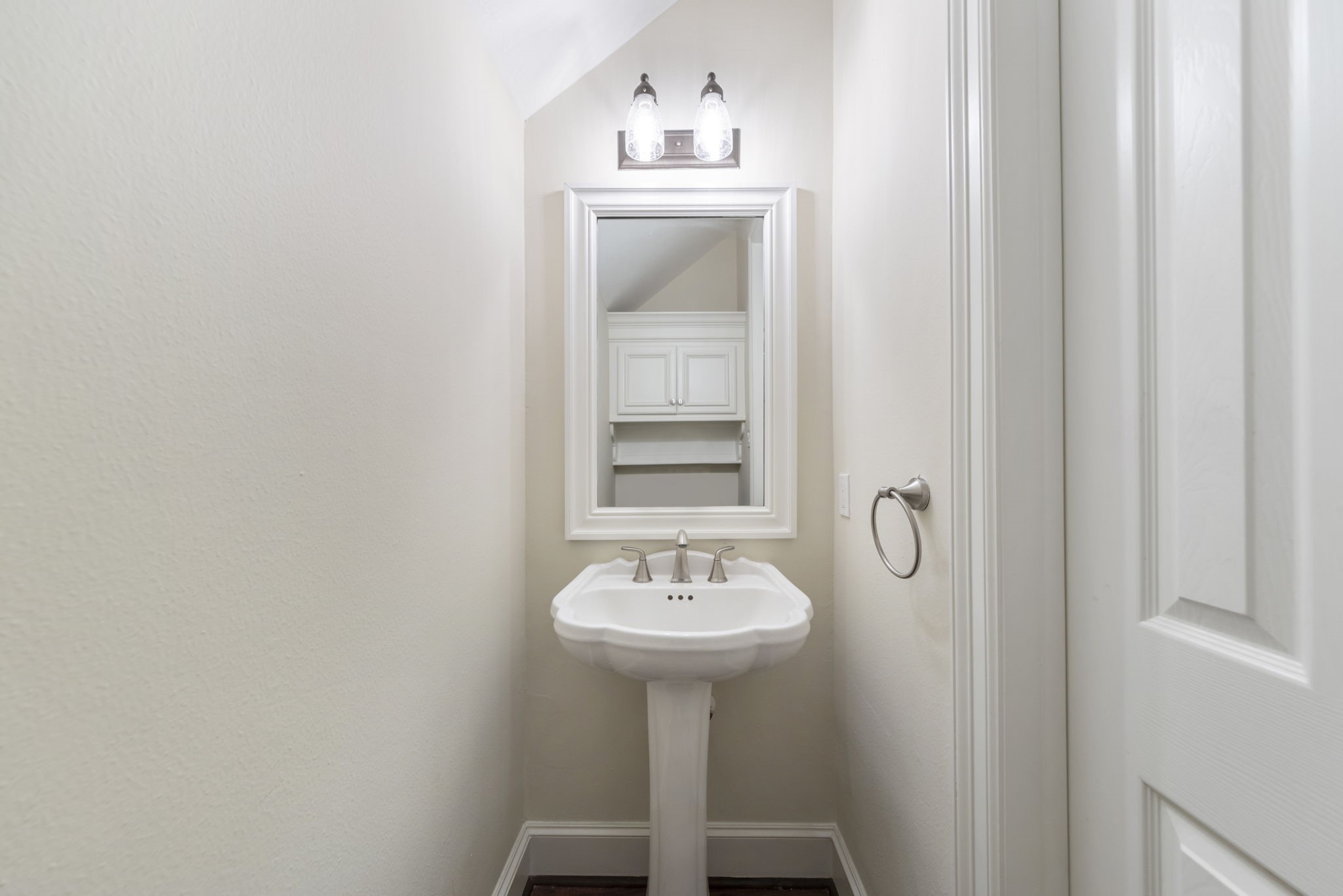 Half bath on first floor offers easy access for guests.