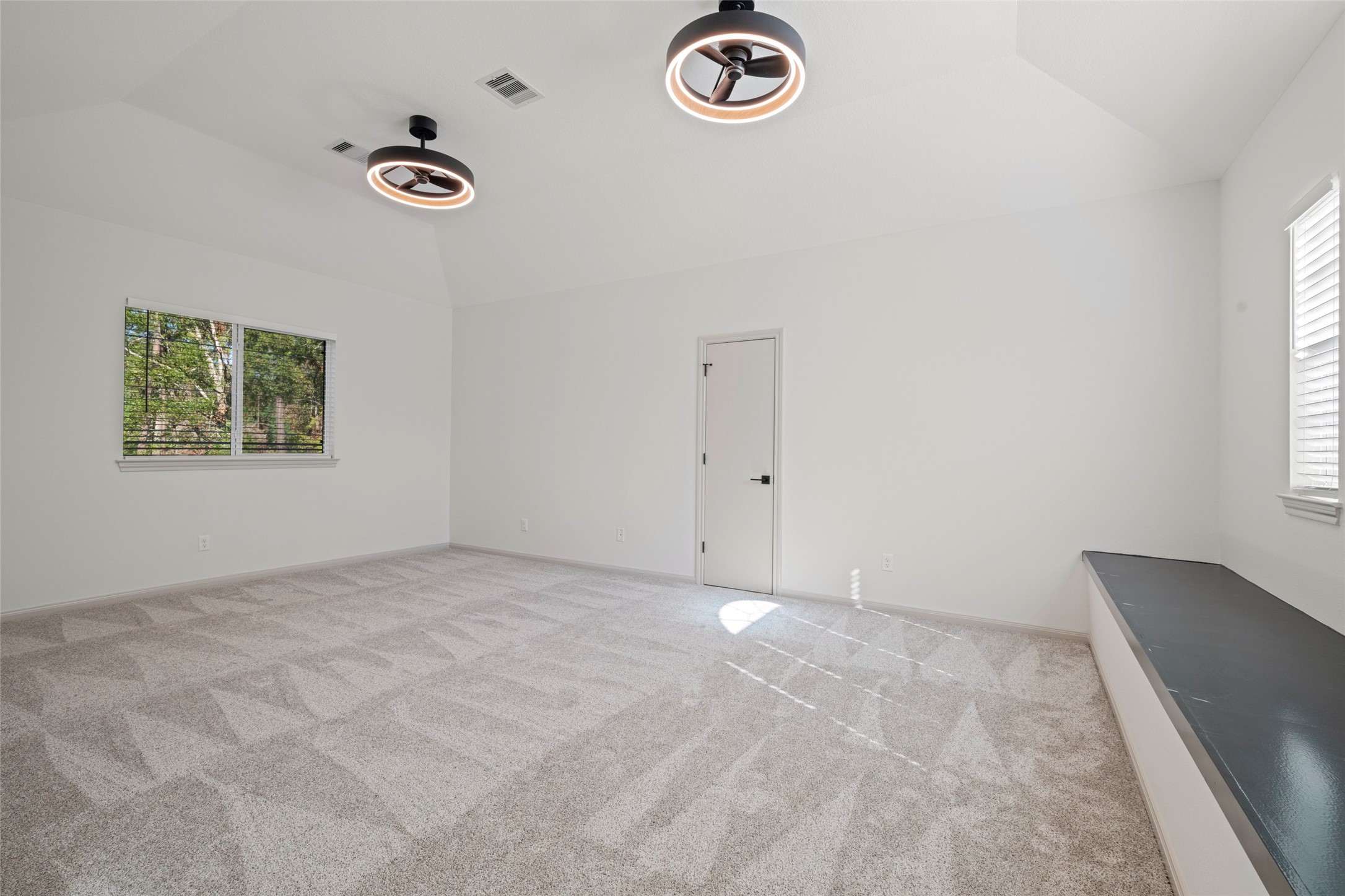 Upstairs game room with window bench