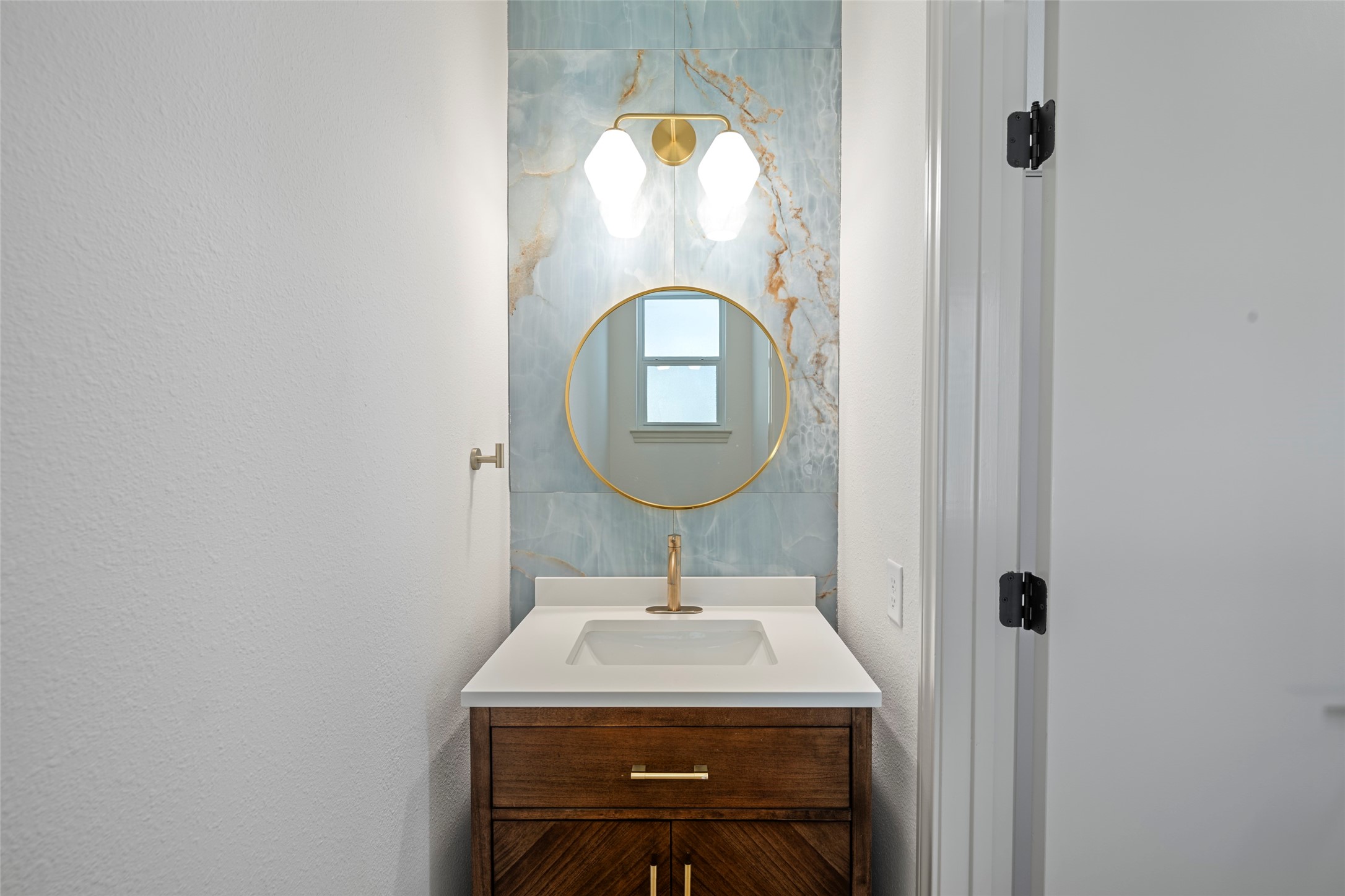 Powder room conveniently located off breakfast room and laundry room