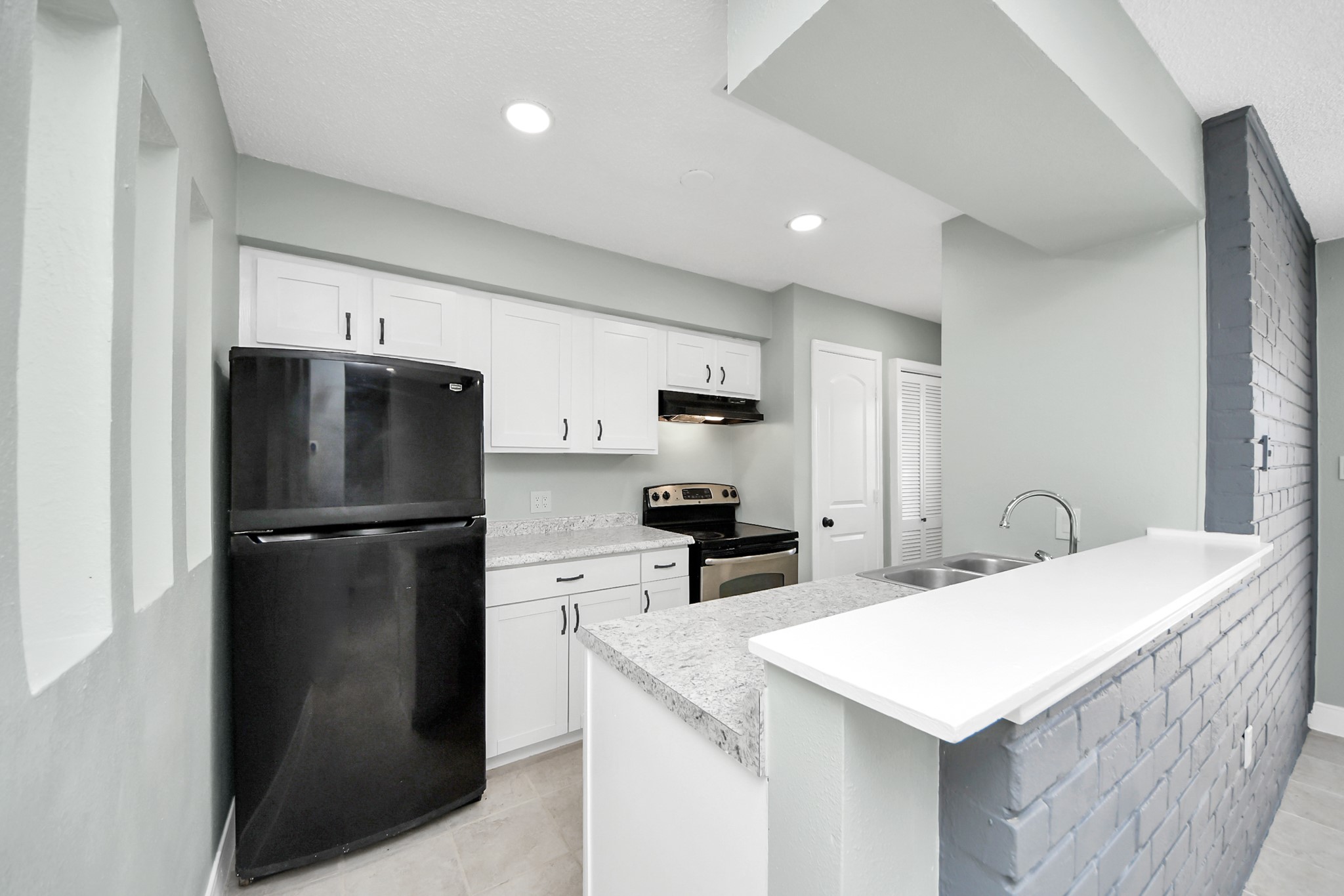 The laundry room is at the end of the kitchen. The laundry room is at the end of the kitchen.