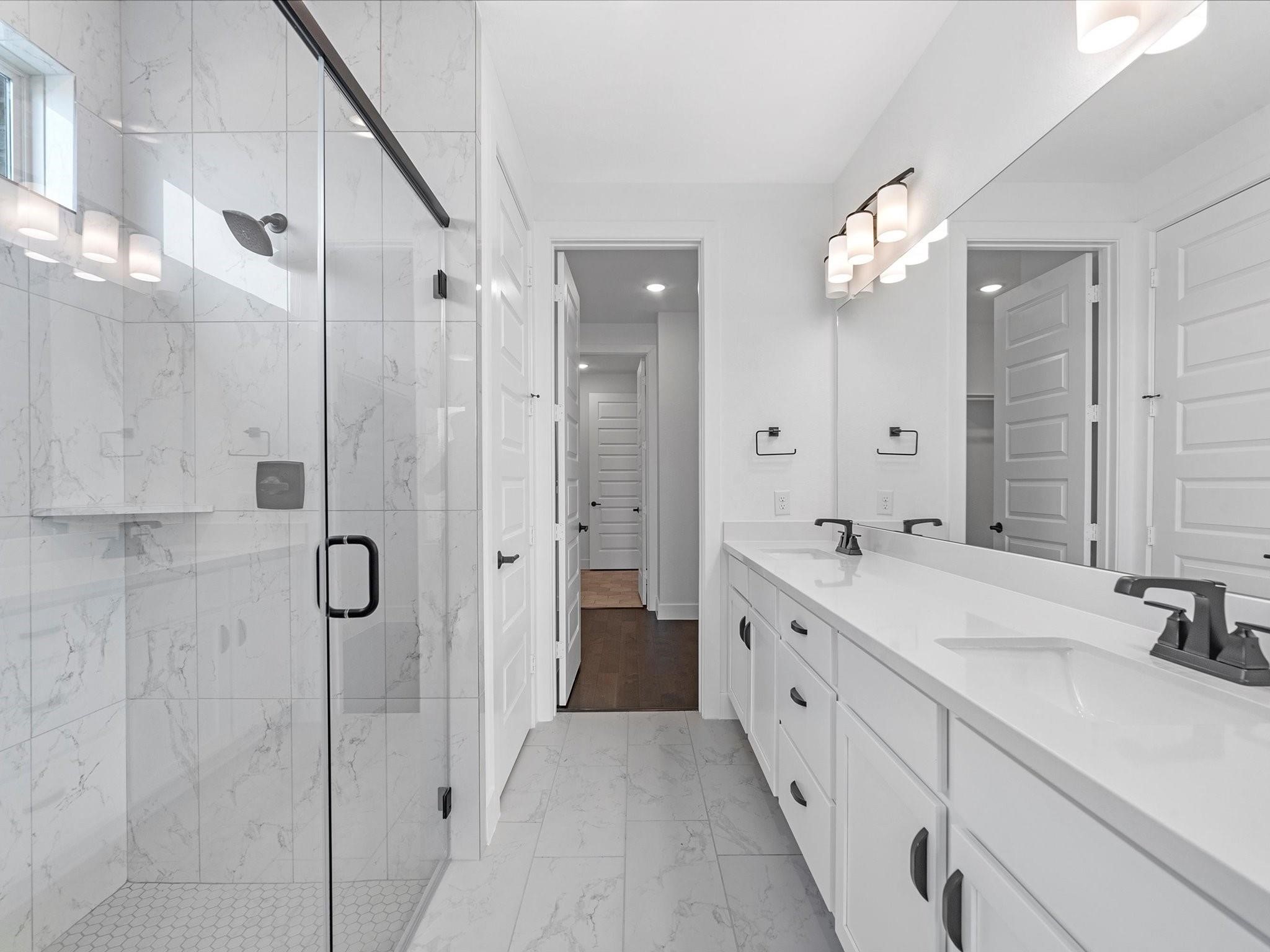 Master bathroom with custom tile upgrade all the way to the ceiling for the standing shower.