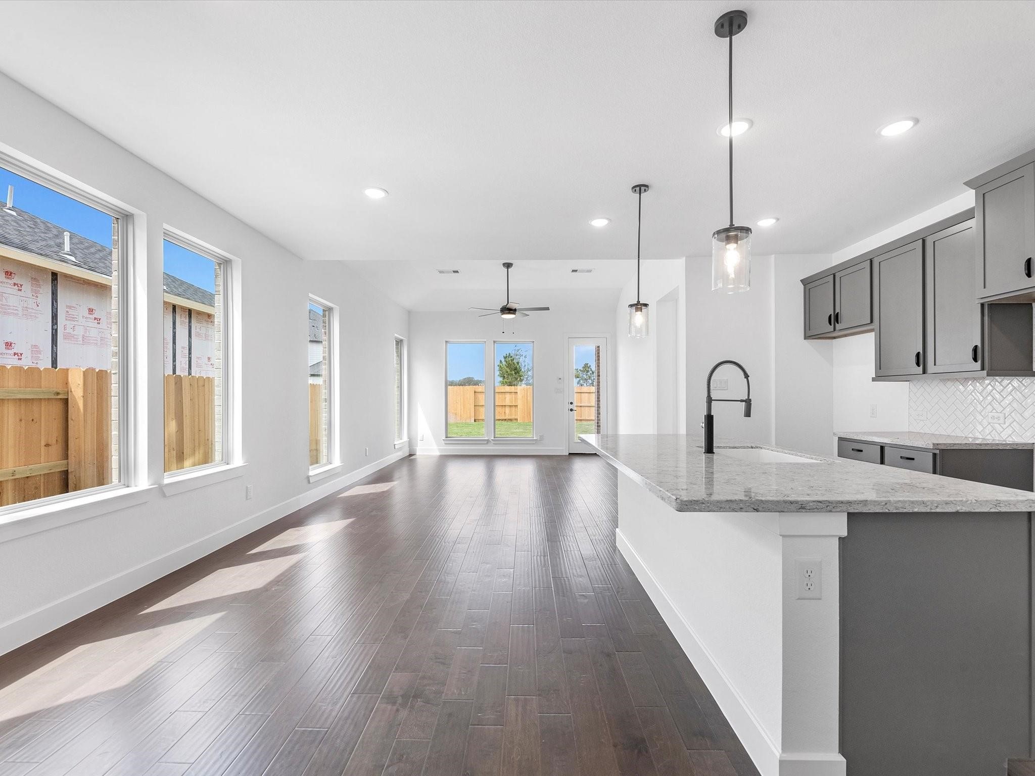 Beautiful and open kitchen connect with family room and a lot big and high windows bring a lot of natural light lights to the first floor