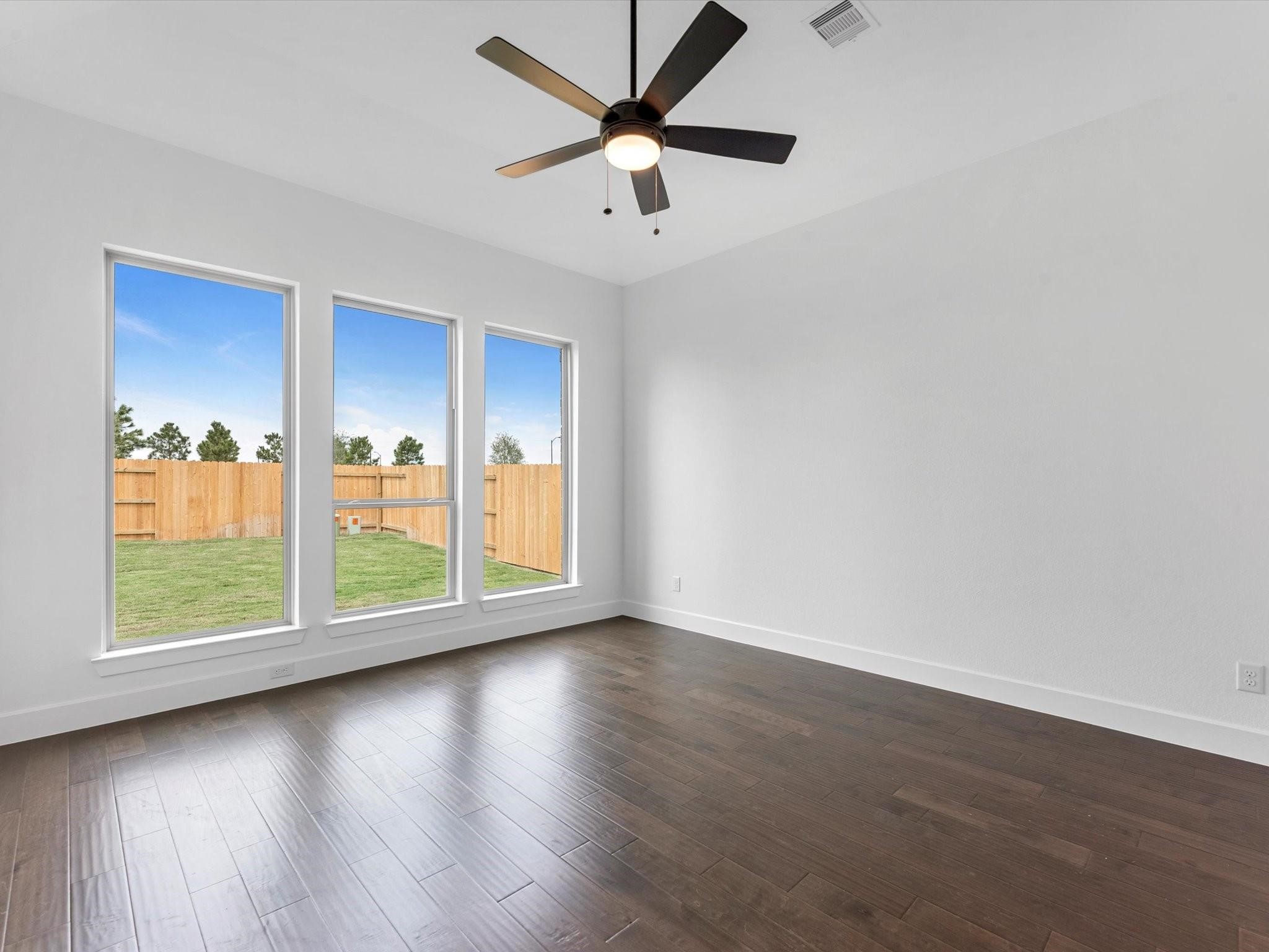 master room look over the backyard with 3 80 feets window