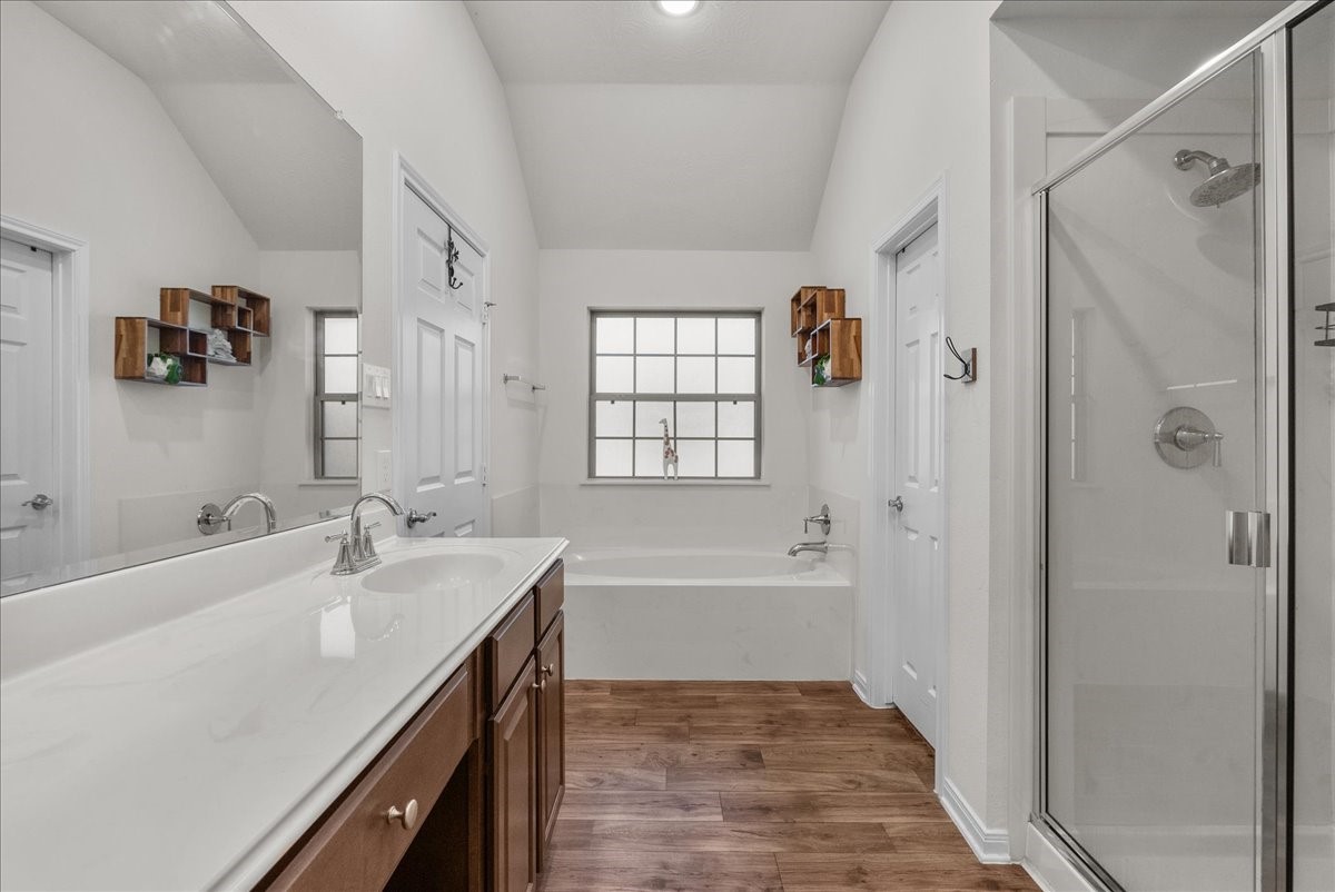 The private en-suite bath features a walk-in shower, soaking tub, double sinks and a walk-in closet