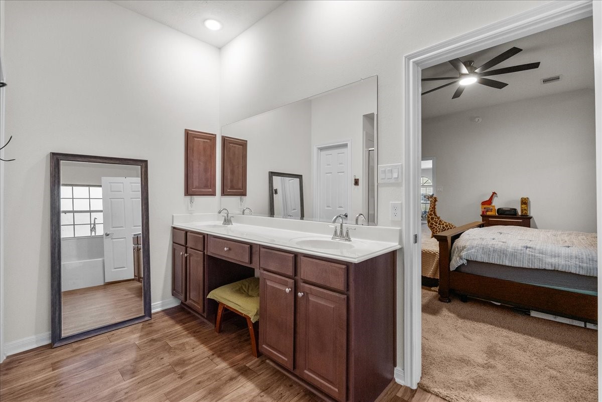 The private en-suite bath features a walk-in shower, soaking tub, double sinks and a walk-in closet
