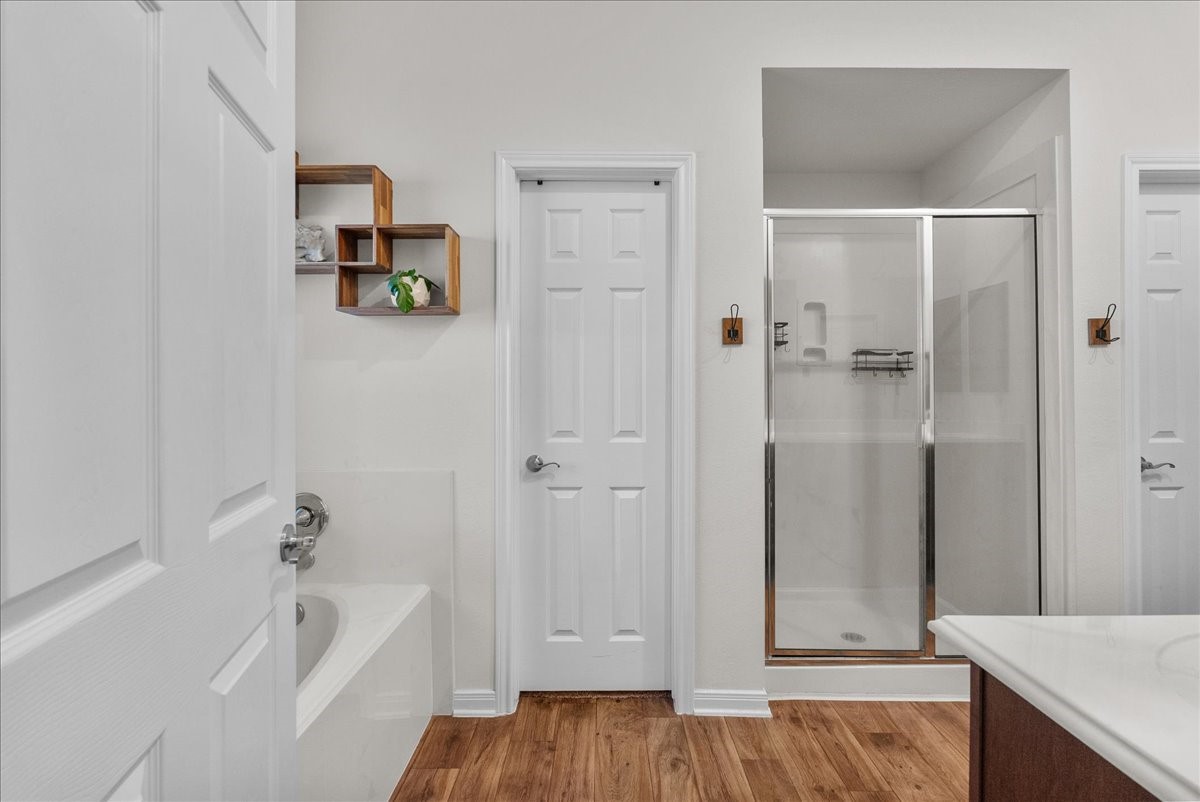 The private en-suite bath features a walk-in shower, soaking tub, double sinks and a walk-in closet