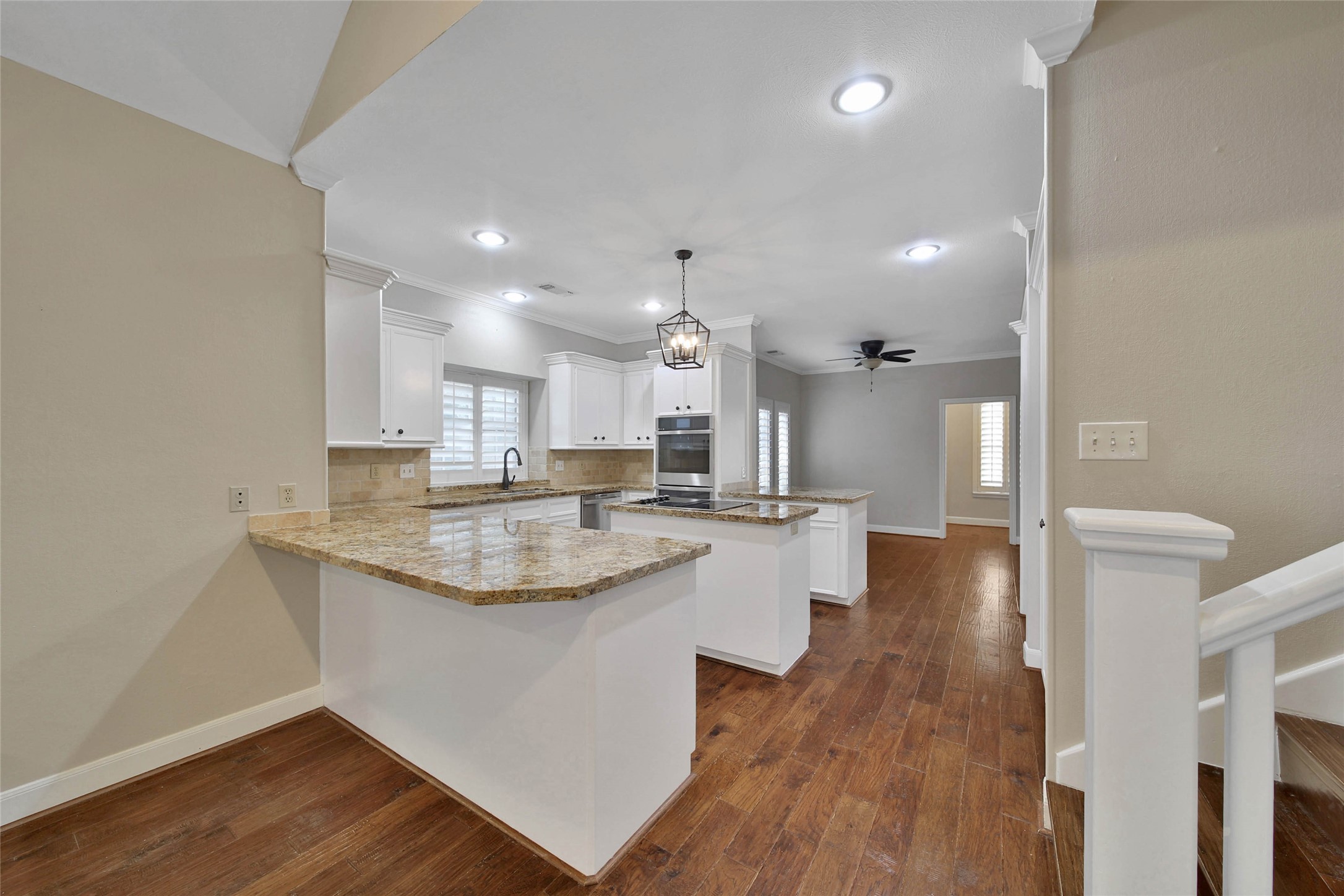 This functional kitchen serves it up, with two breakfast bars, and island cooktop, under and upper cabinet lighting, and custom built in pantry shelving, Multi-feature GE Profile double oven features convection cooking. GE Profile Dishwasher. Huge Breakfast room is adjacent to the kitchen with the butlers pantry / laundry utility room access.