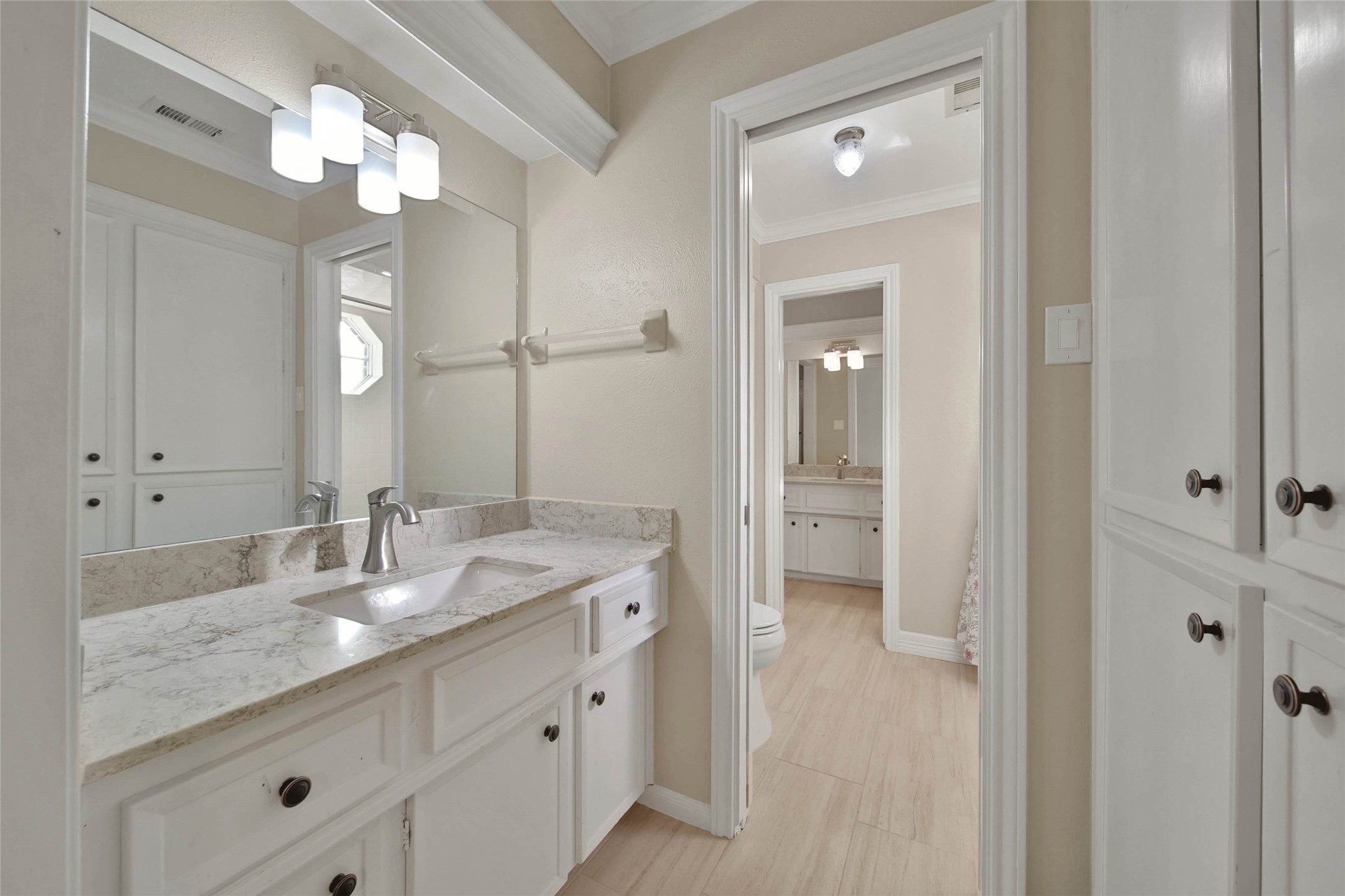 The upstairs has two Hollywood baths and features lots of storage!