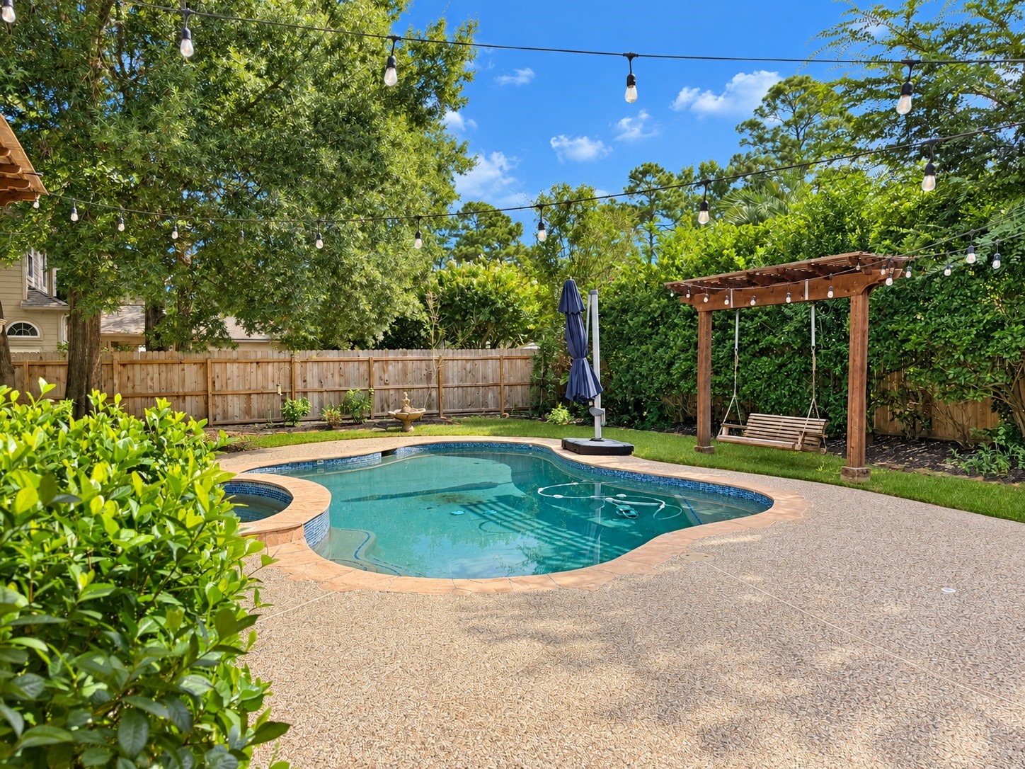 Private landscaping and extended pool decking for you to relax and cool off in the pool.