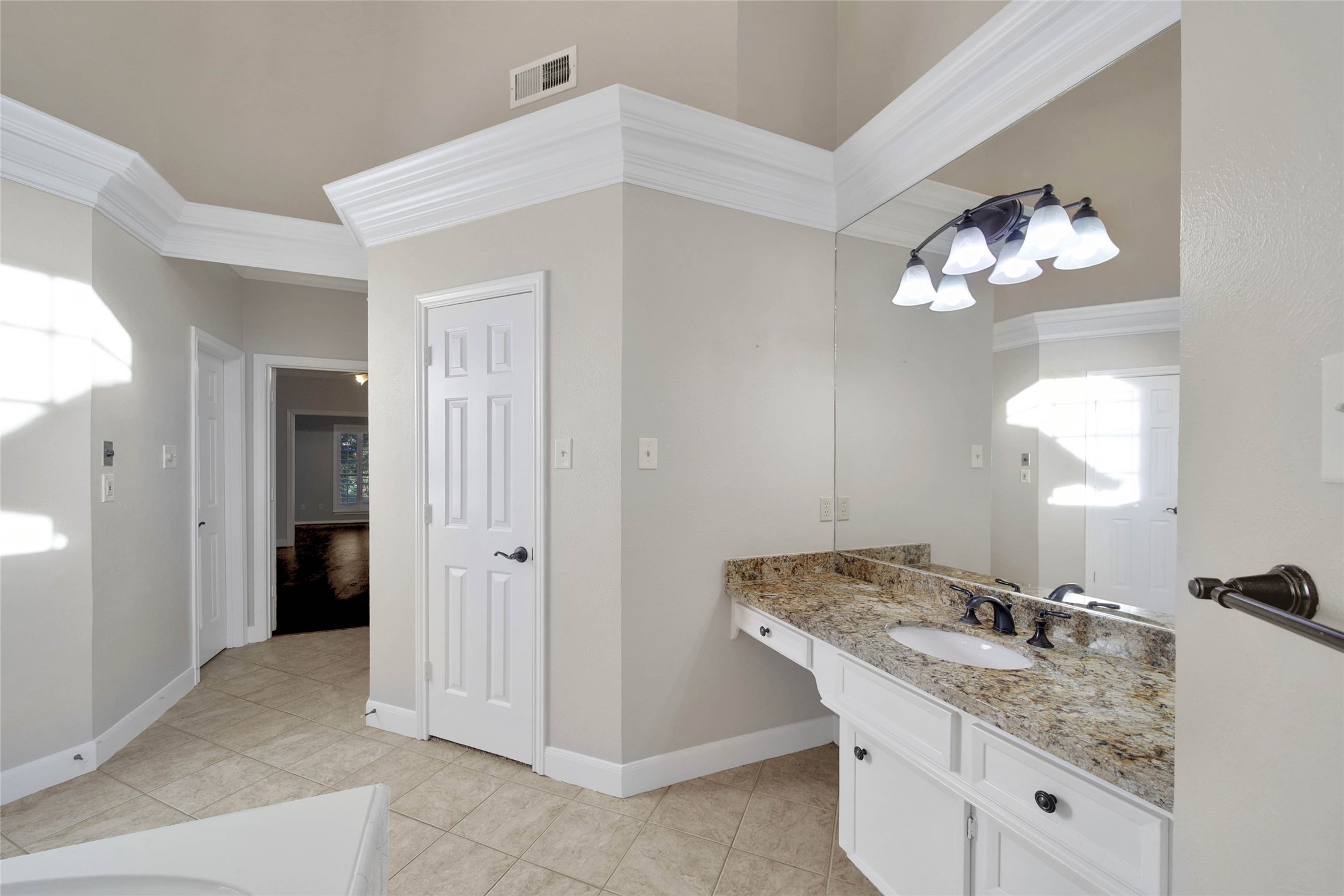 Wow the primary bathroom is a suite all by itself! So much to see here! Separate closets, separate vanities, oversize shower, lots of storage, and high ceilings!