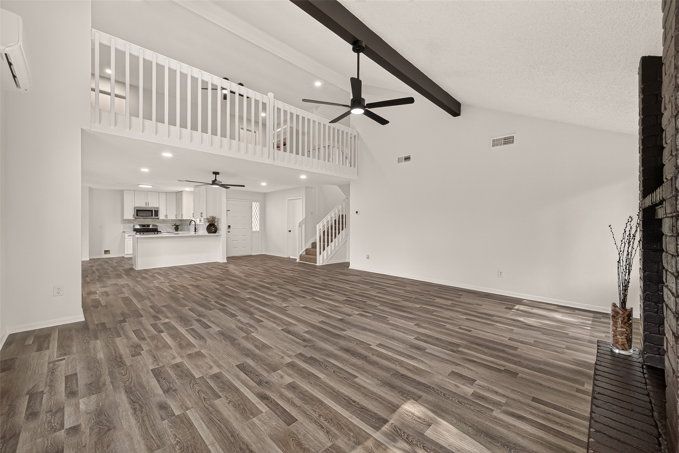 Another view of the open-concept living/dining area, seamlessly connecting to an updated kitchen
