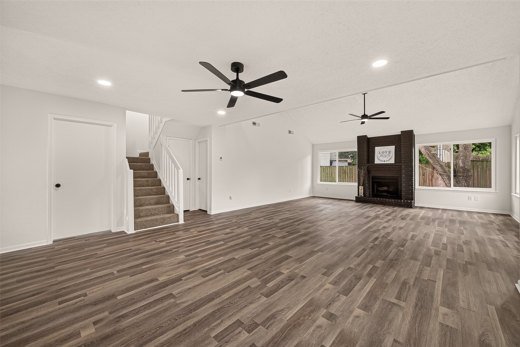 Stairs are located by the principal bedroom and half bath leading to second floor