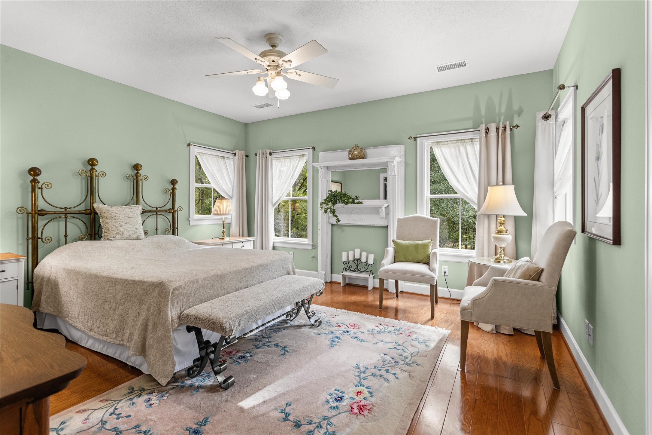 Primary suite surrounded by windows