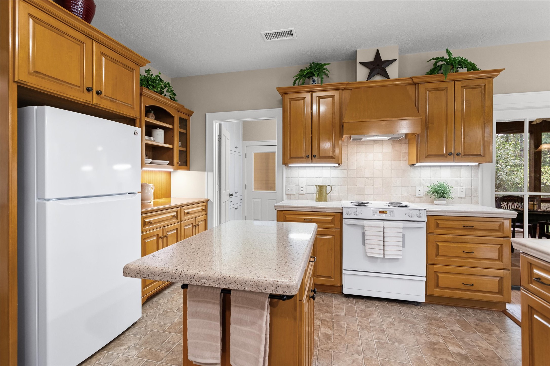 Warm wood cabinetry and space to cook together