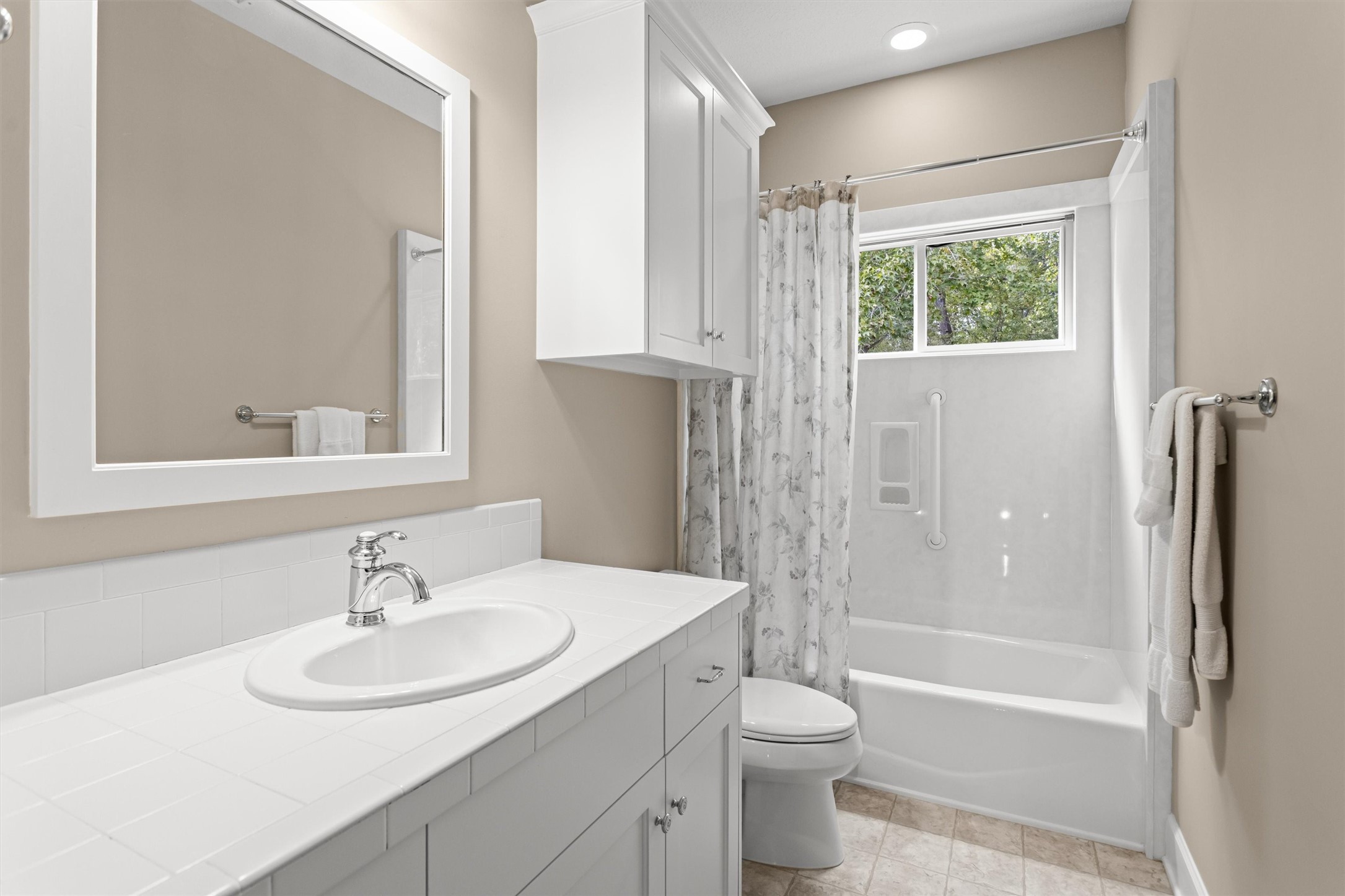 Secondary bath with a tub and shower combo
