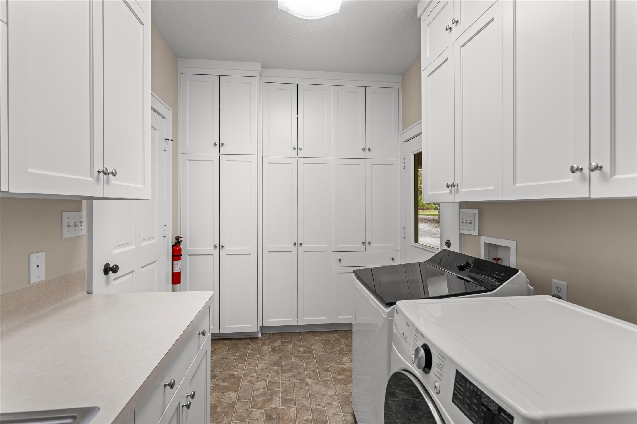 Utility room with storage and folding space