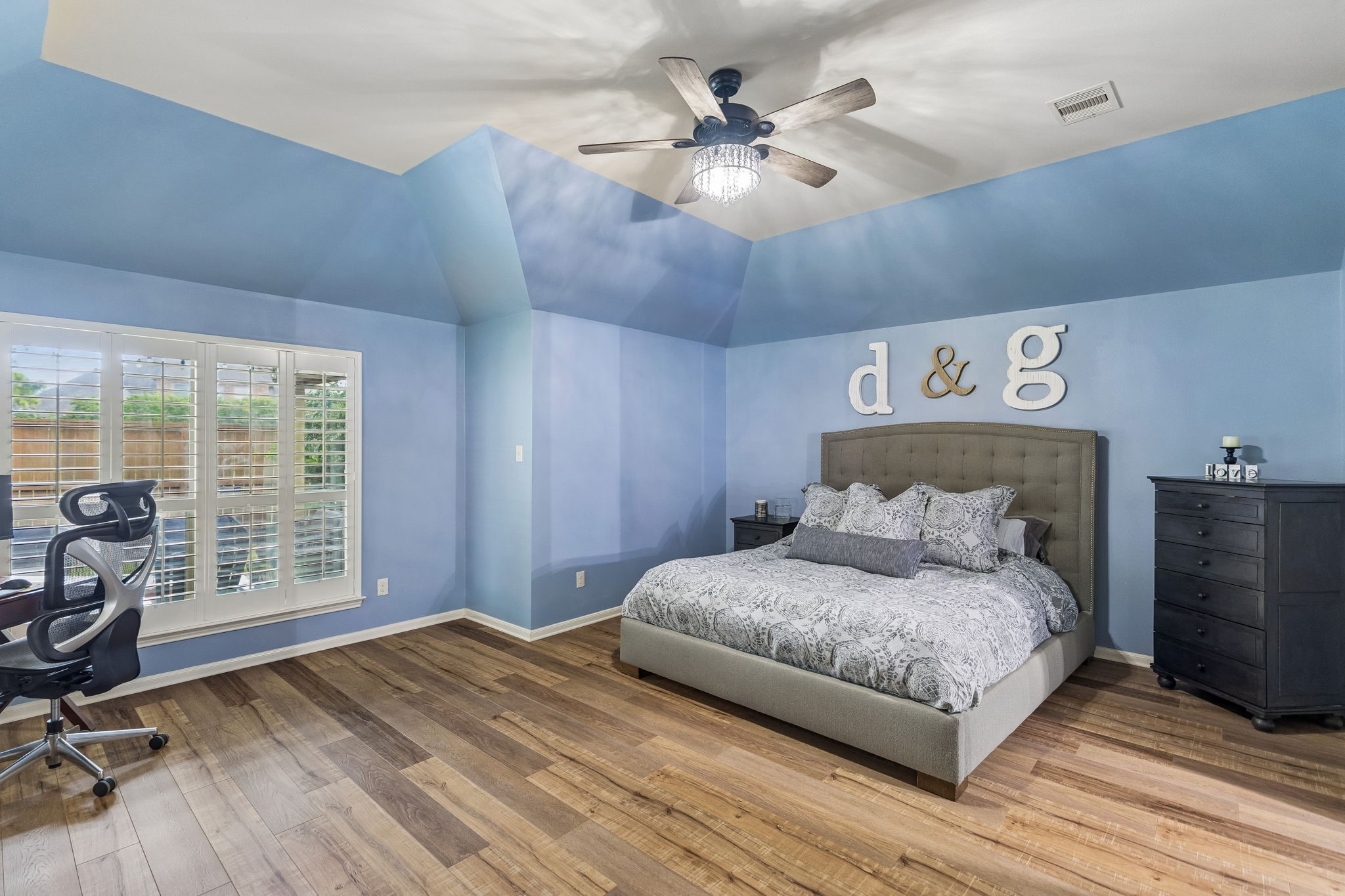 Spacious bedroom with soft natural light, ceiling fan, and generous room for furnishings. Spacious bedroom with soft natural light, ceiling fan, and generous room for furnishings.