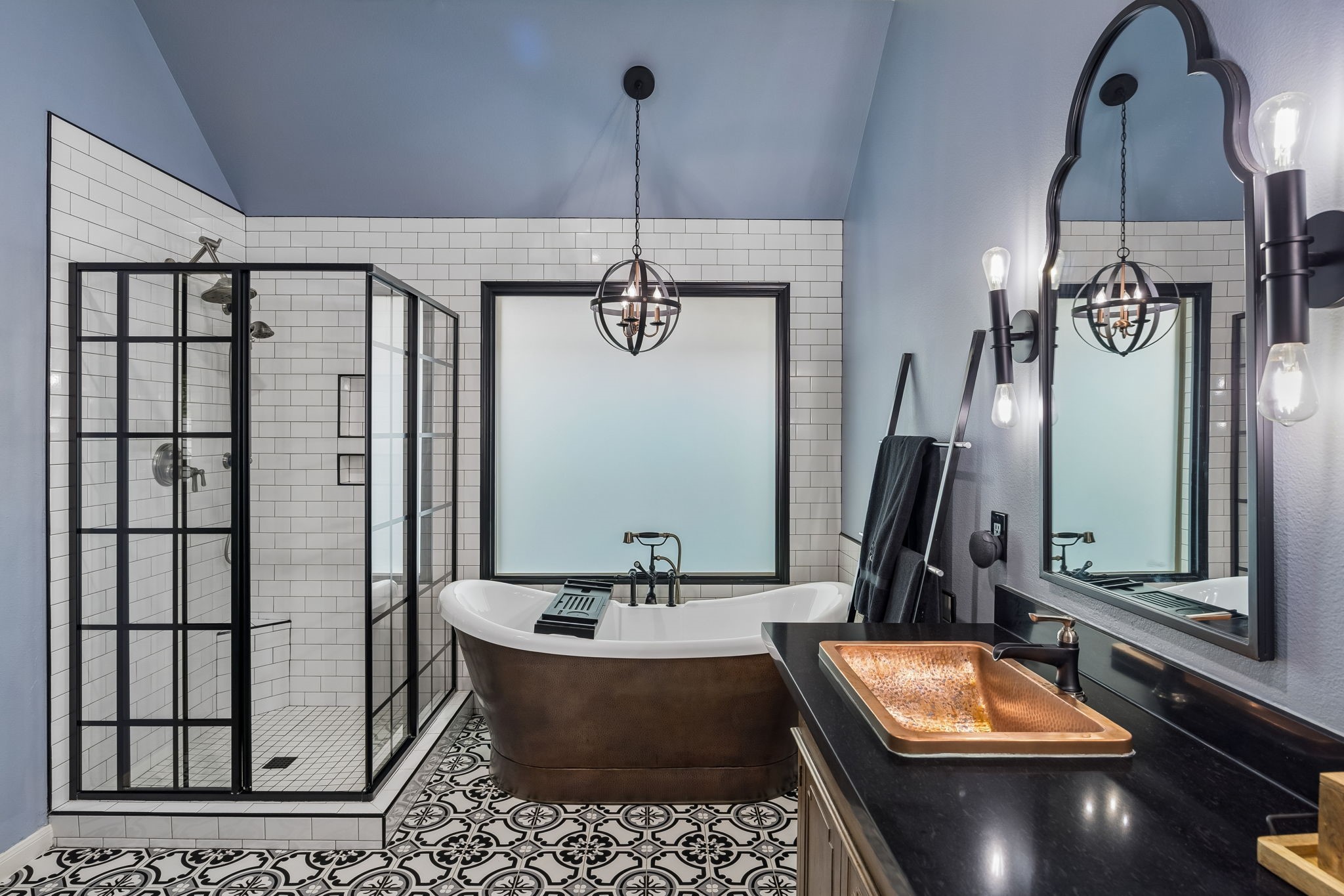 Additional view of the primary bath highlighting the tub, separate shower, and generous vanity space.