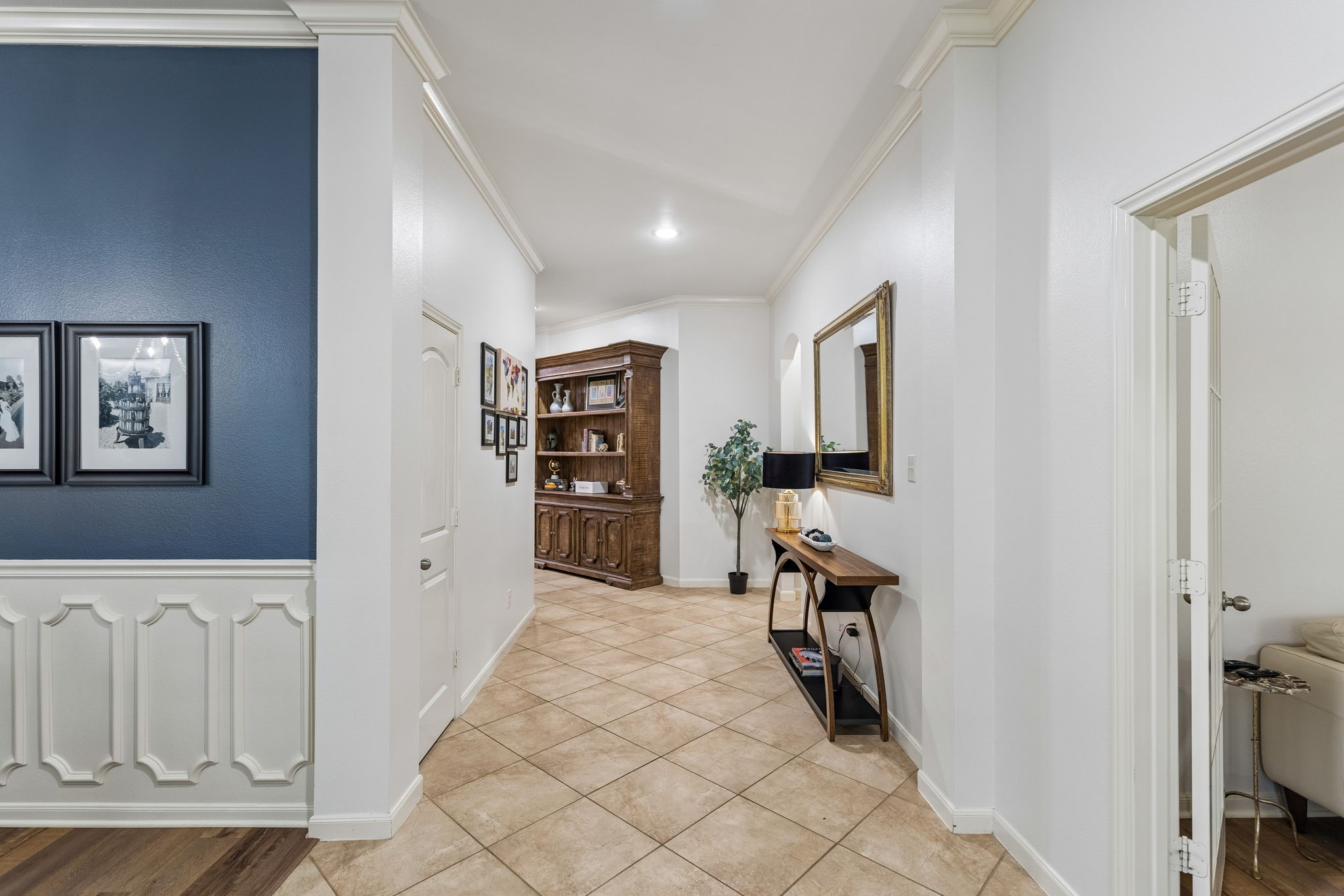 Bright interior hallway with neutral finishes and an easy flow into the surrounding living spaces.