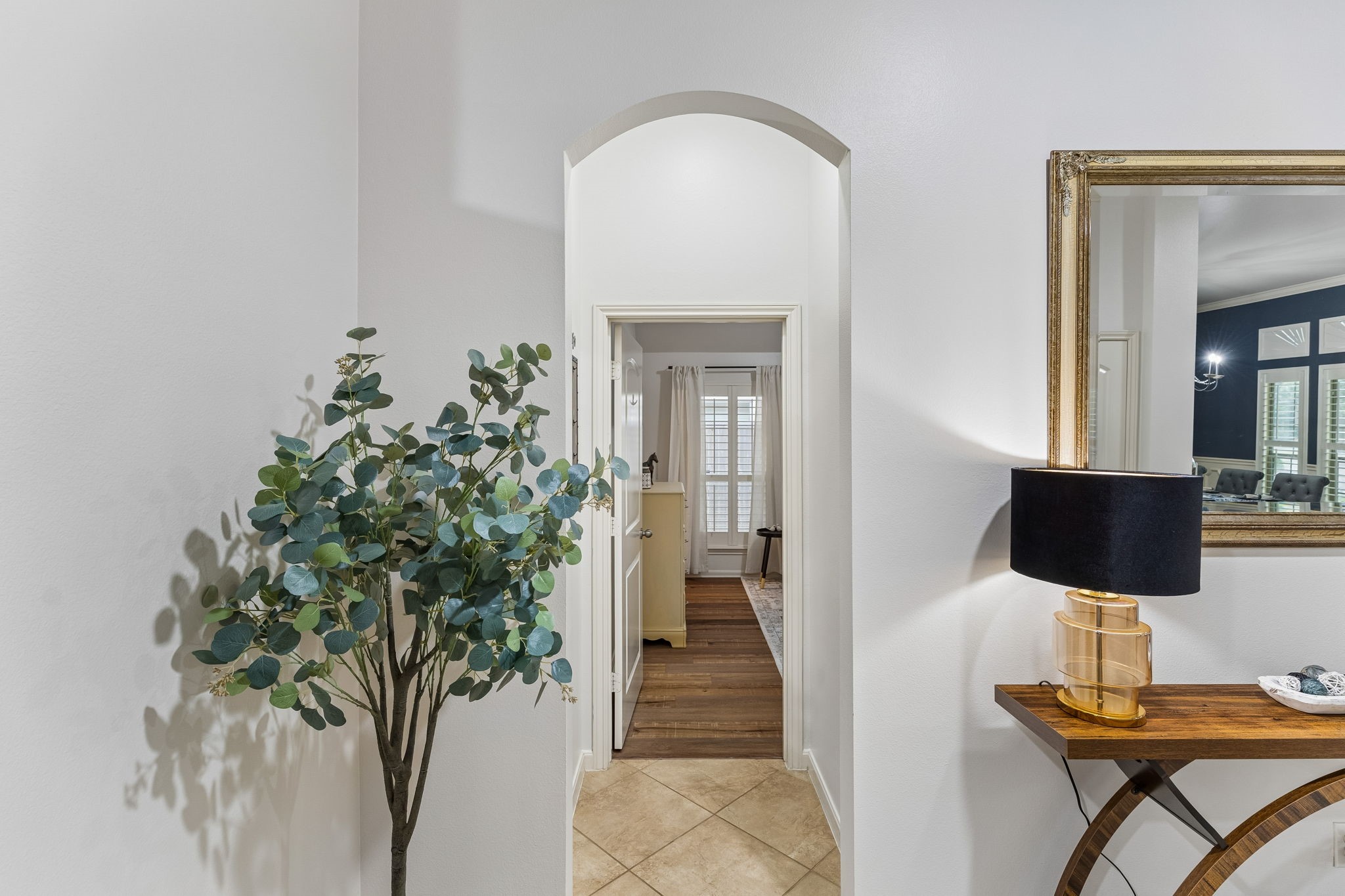 Bright interior passage connecting the main living areas with an open, airy feel and neutral finishes.