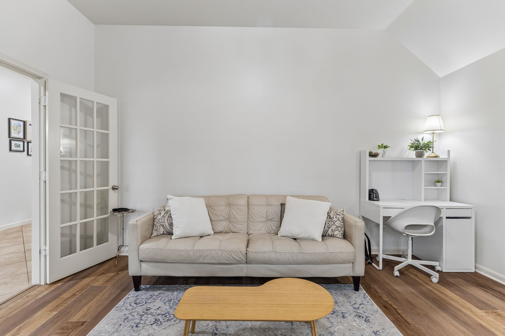 Comfortable living area with abundant natural light, neutral tones, and a welcoming layout.
