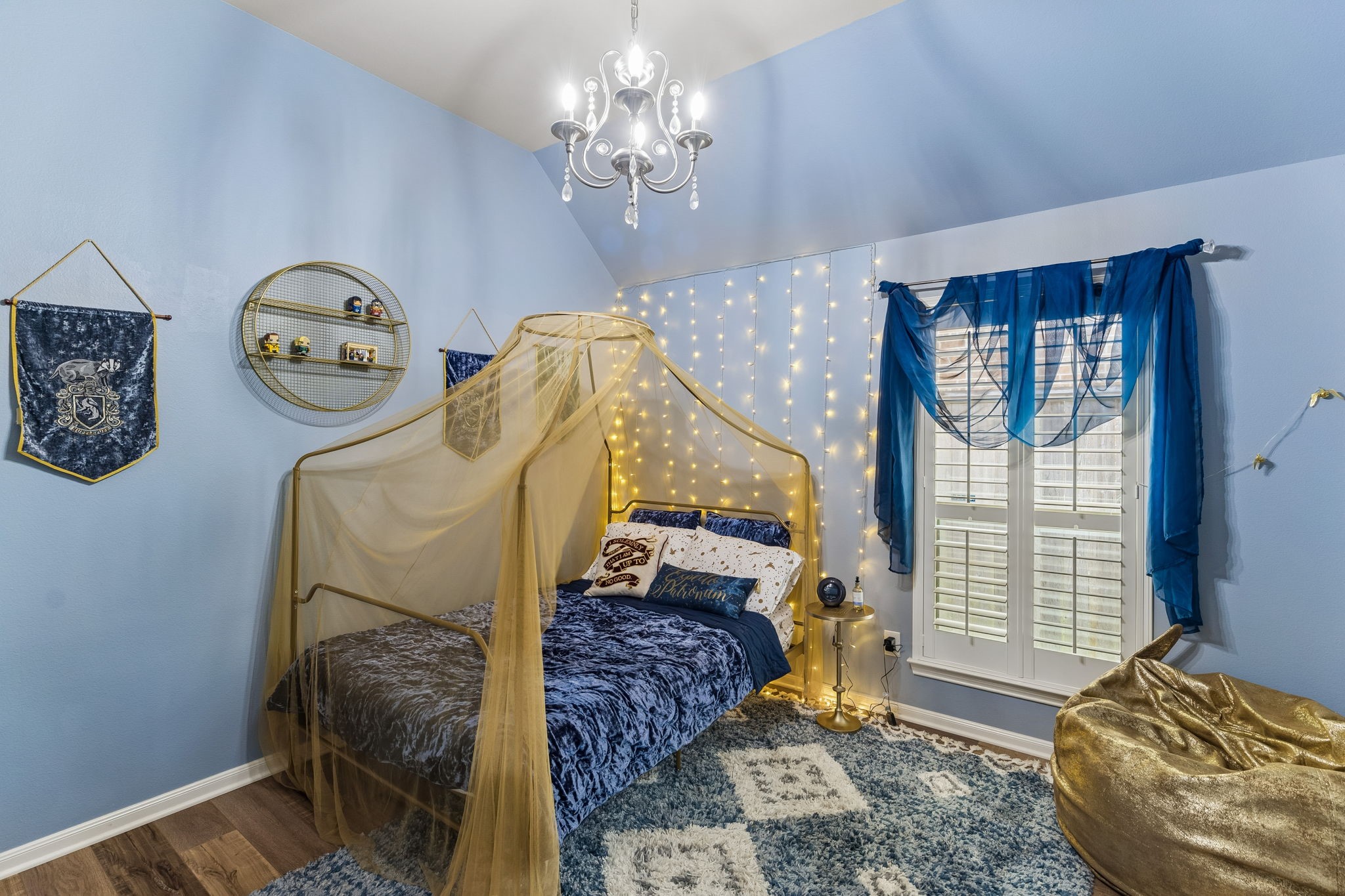 Alternate bedroom view showing a flexible layout with room for a sitting or study area.