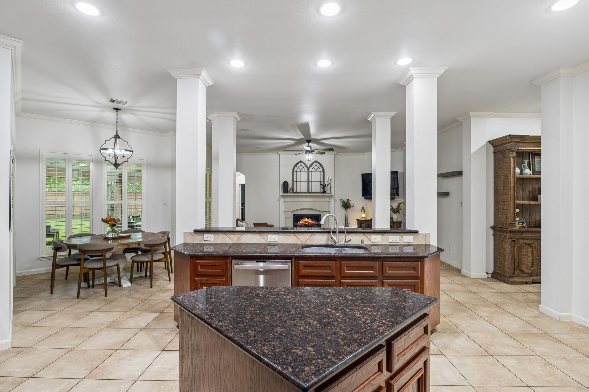 Large center island provides additional prep space and creates an open connection to the surrounding living areas.