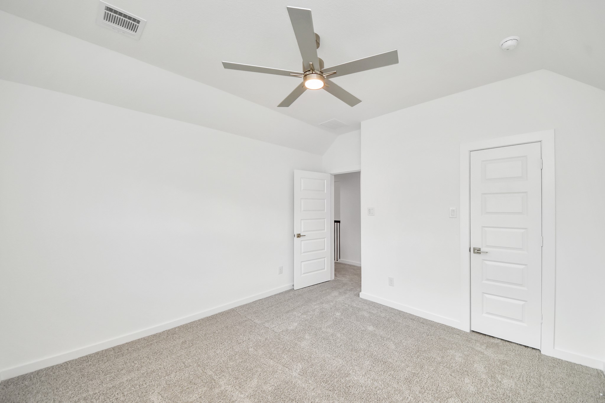 Generously sized secondary bedrooms featuring spacious closets, soft and inviting carpeting underfoot, large windows allowing plenty of natural light, and the added touch of privacy blinds for your personal retreat. Sample photo of completed home with similar floor plan. Actual colors and selections may vary.