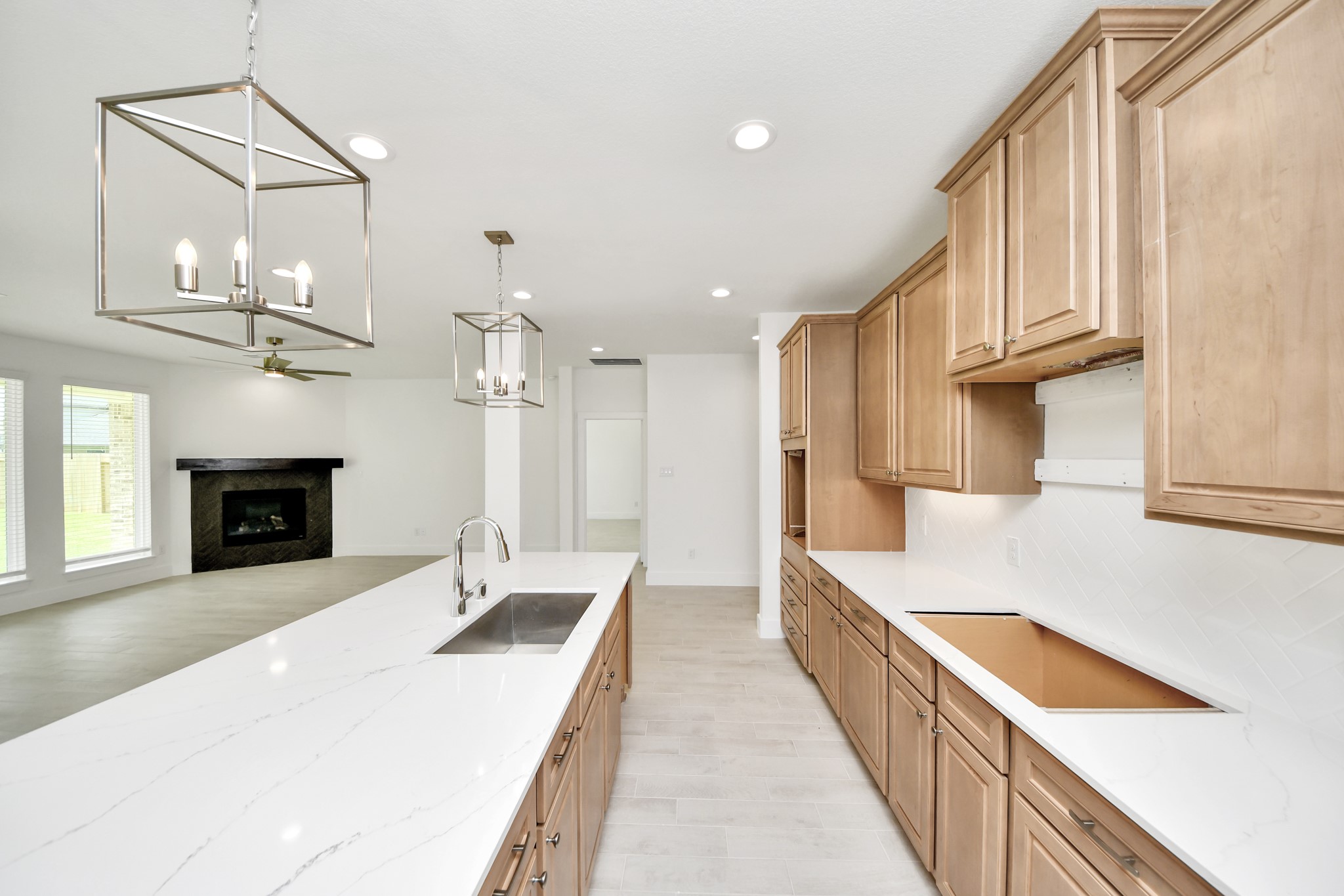 The extended counter area adds both practicality and style, making meal preparation a breeze. Every detail is thoughtfully designed to enhance the kitchen's functionality and aesthetic appeal. Sample photo of completed home with similar floor plan. Actual colors and selections may vary.