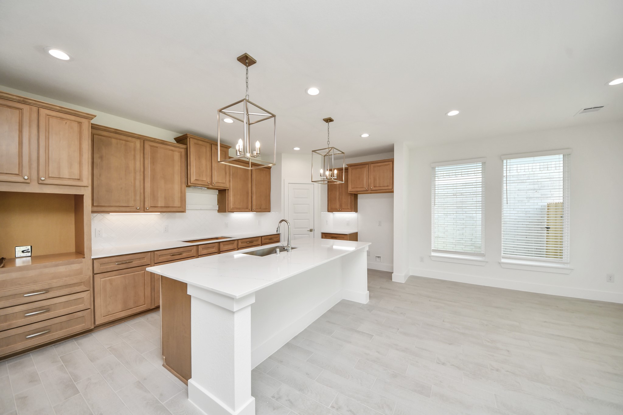 The kitchen is a culinary haven, featuring granite countertops, a tile backsplash, stainless steel appliances, 42 upper cabinets, and undercabinet lighting. Sample photo of completed home with similar floor plan. Actual colors and selections may vary. The kitchen is a culinary haven, featuring granite countertops, a tile backsplash, stainless steel appliances, 42 upper cabinets, and undercabinet lighting. Sample photo of completed home with similar floor plan. Actual colors and selections may vary.