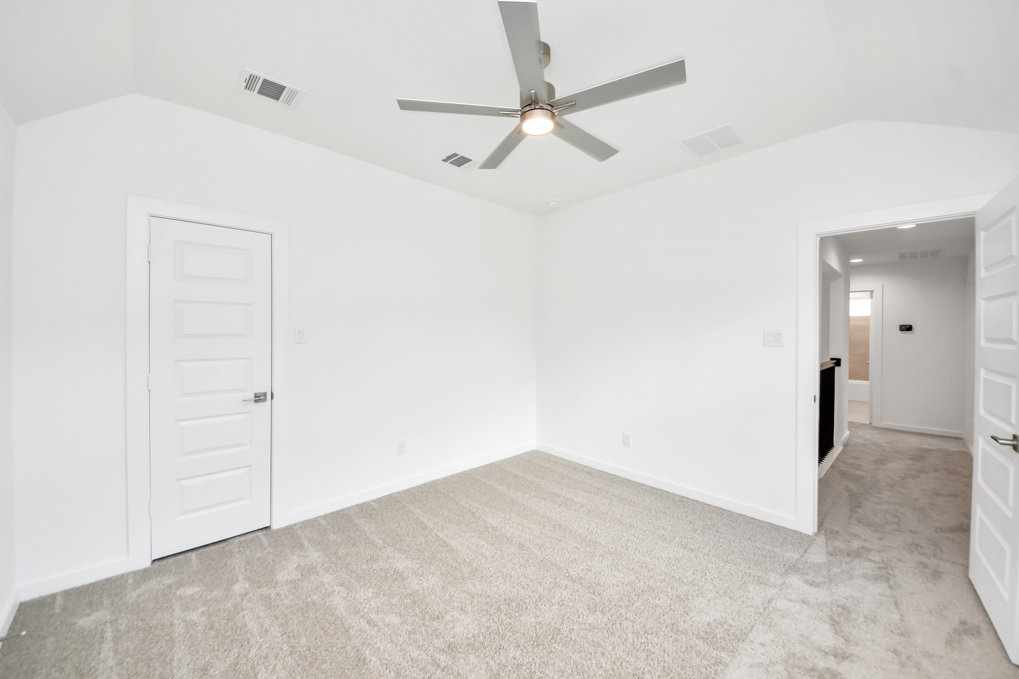 Generously sized secondary bedrooms featuring spacious closets, soft and inviting carpeting underfoot, large windows allowing plenty of natural light, and the added touch of privacy blinds for your personal retreat. Sample photo of completed home with similar floor plan. Actual colors and selections may vary.