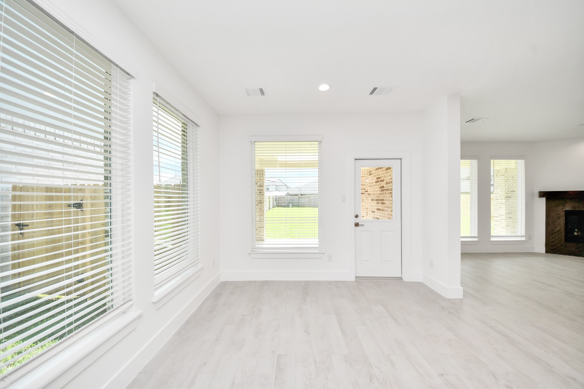 Make memories gathered around the table with your family and friends! This spacious dining room features elegant flooring, custom paint, and adjacent to family room and kitchen for open concept feel. Sample photo of completed home with similar floor plan. Actual colors and selections may vary.