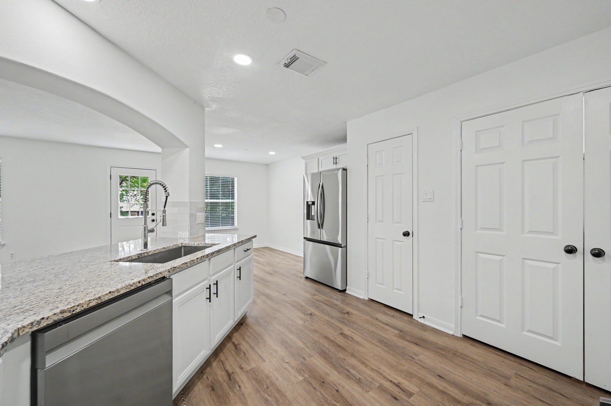 Refrigerator in kitchen included.