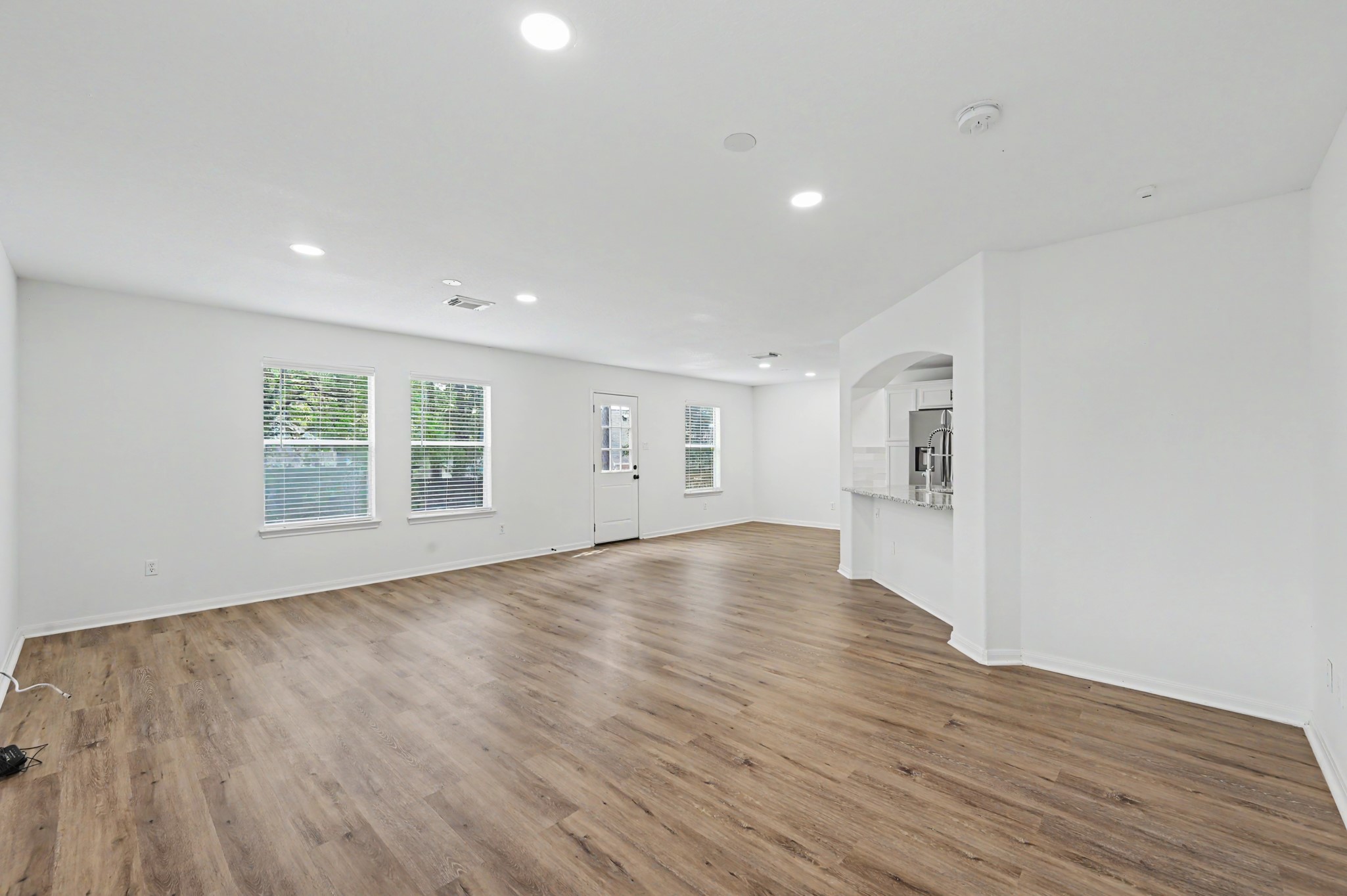 Large living room with excellent lighting.