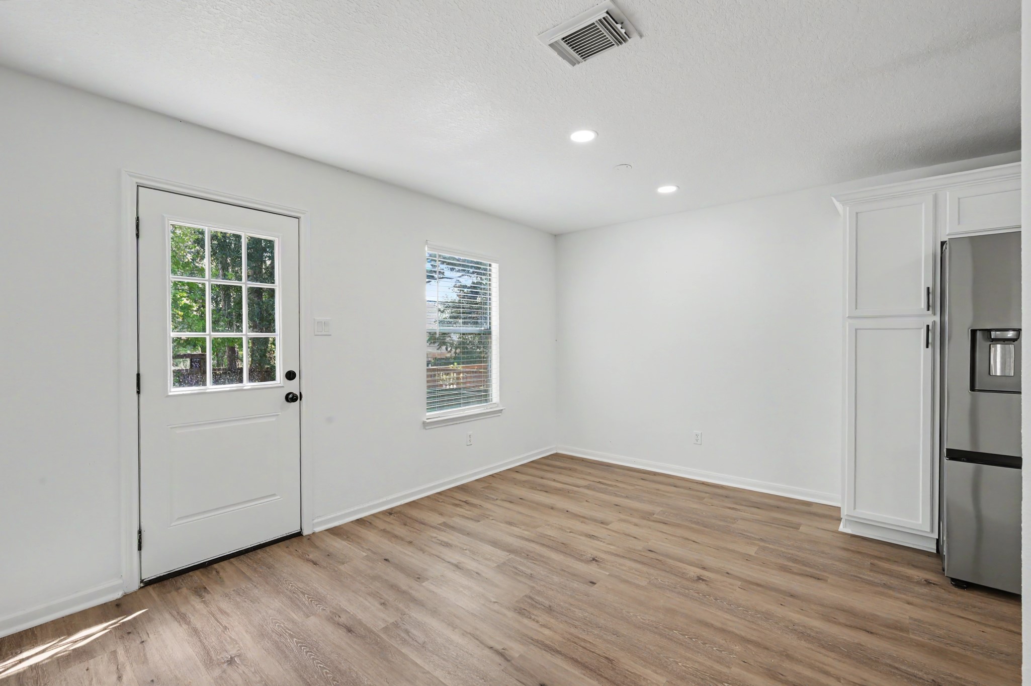 Dining area open to kitchen and living room.