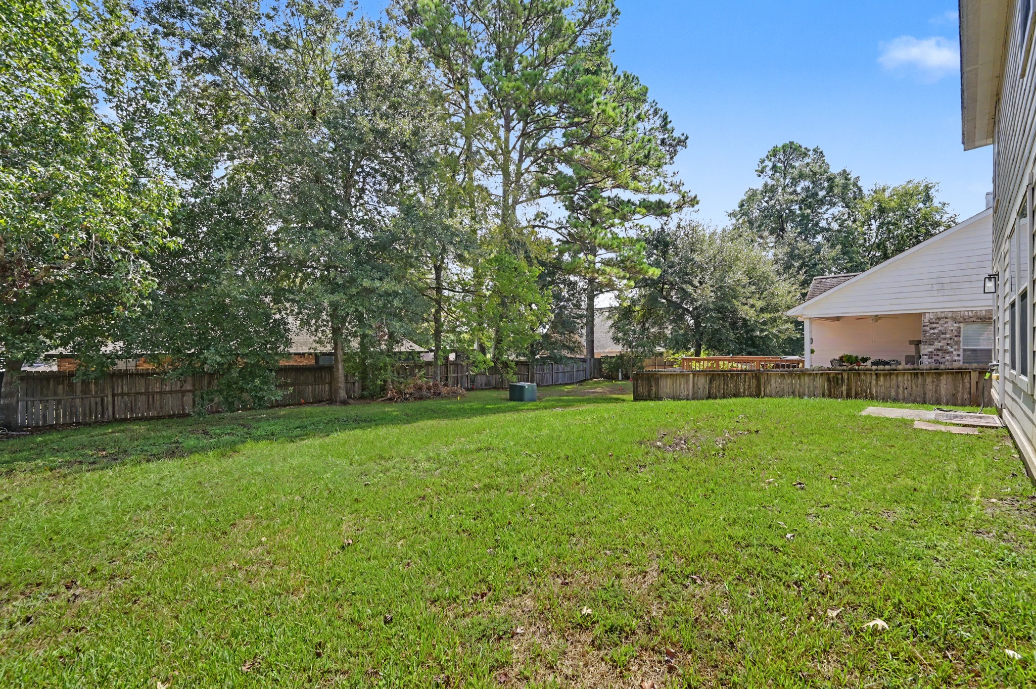 Mature trees line the back yard
