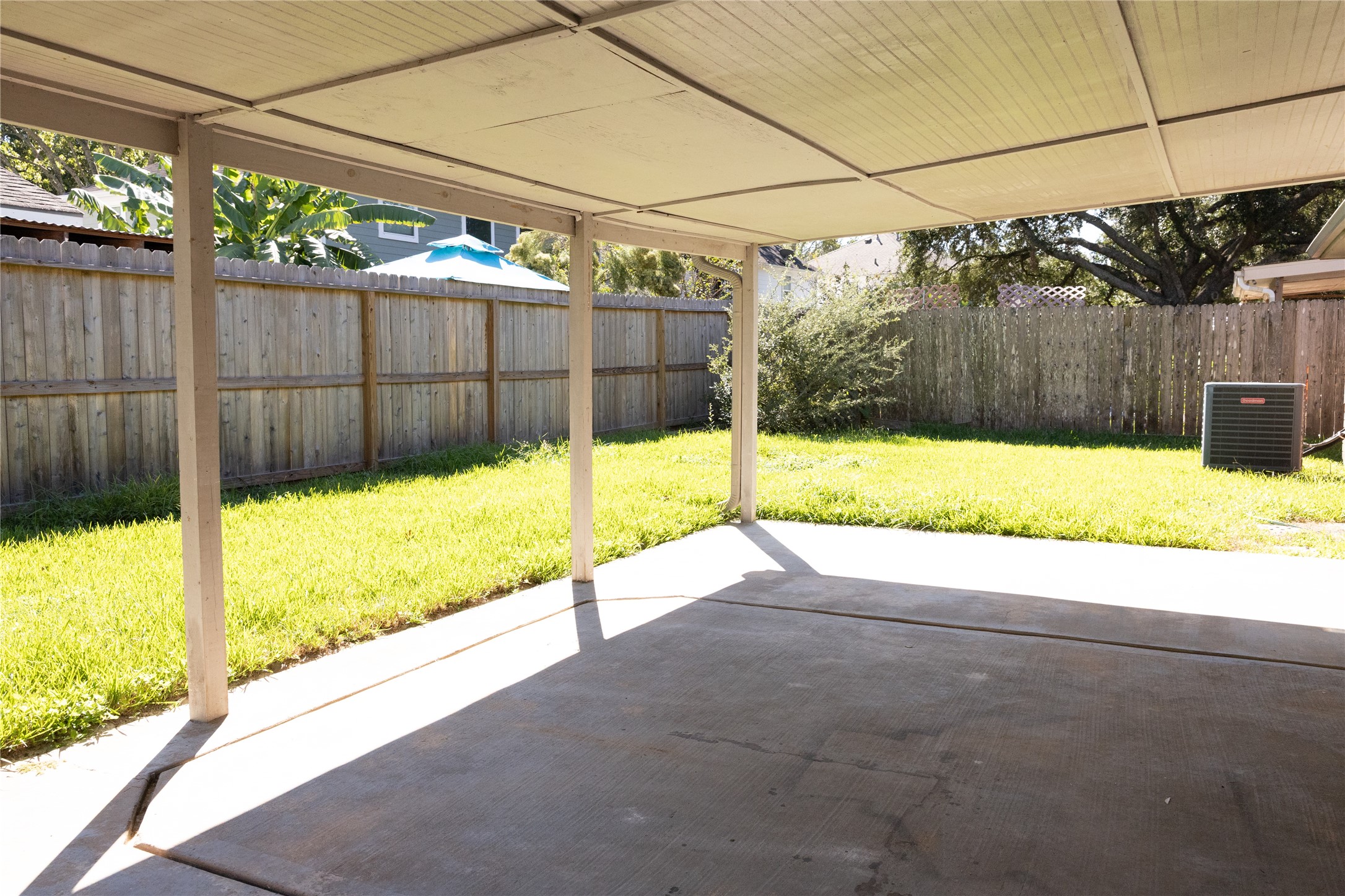 Large backyard with covered porch.