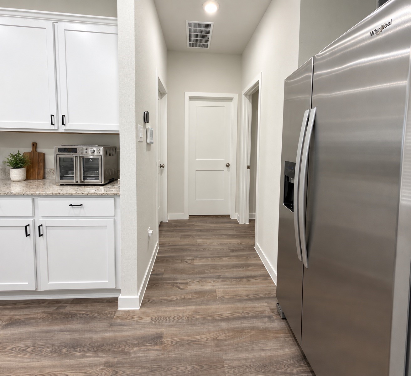 Kitchen with Convenient Access to Additional Rooms Kitchen with Convenient Access to Additional Rooms