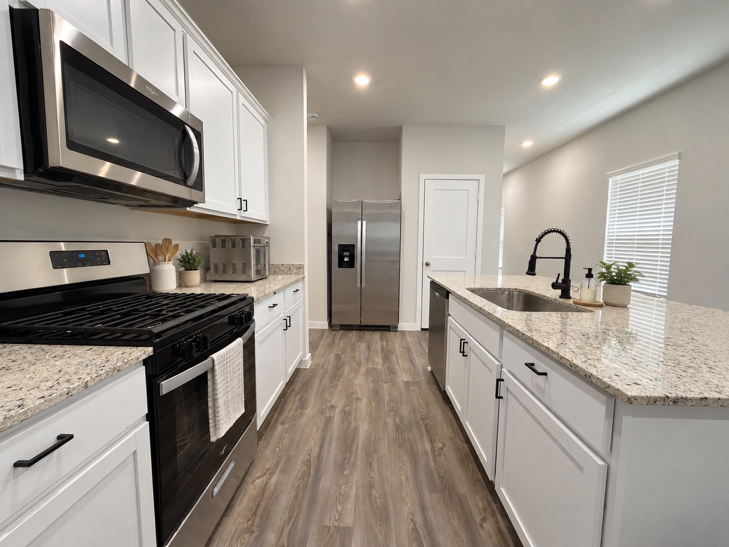 Kitchen with Granite Countertops and Stainless Steel Appliances Kitchen with Granite Countertops and Stainless Steel Appliances