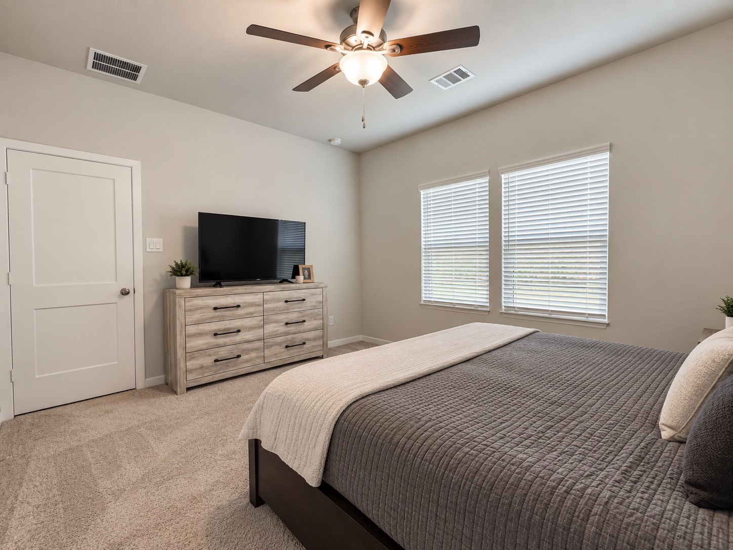 Spacious Primary Bedroom with Ceiling Fan Spacious Primary Bedroom with Ceiling Fan