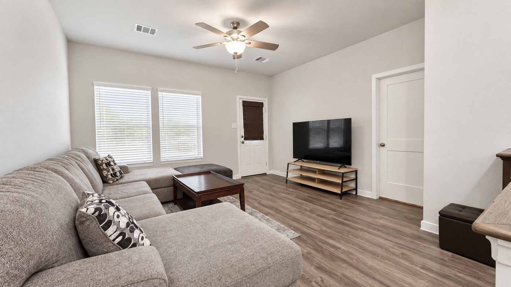 Spacious Living Room with Natural Light and Open-Concept Layout Spacious Living Room with Natural Light and Open-Concept Layout