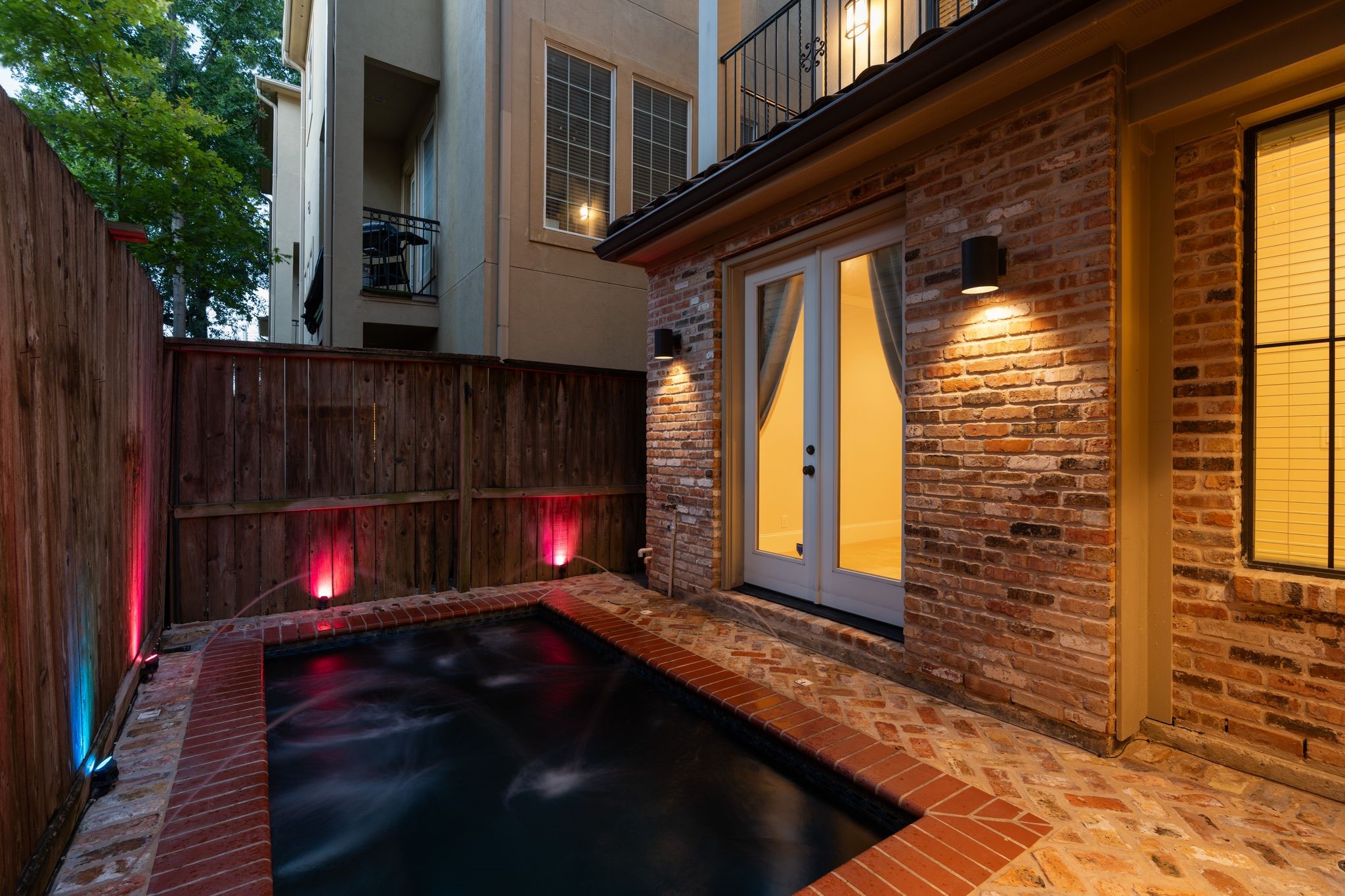 Private Plunge Pool | Outdoor Living  A little slice of Mediterranean living in the middle of Houston. Whether enjoying a refreshing evening dip or gathering with friends around the adjoining summer kitchen, this intimate outdoor retreat makes every day feel a little more like a getaway.