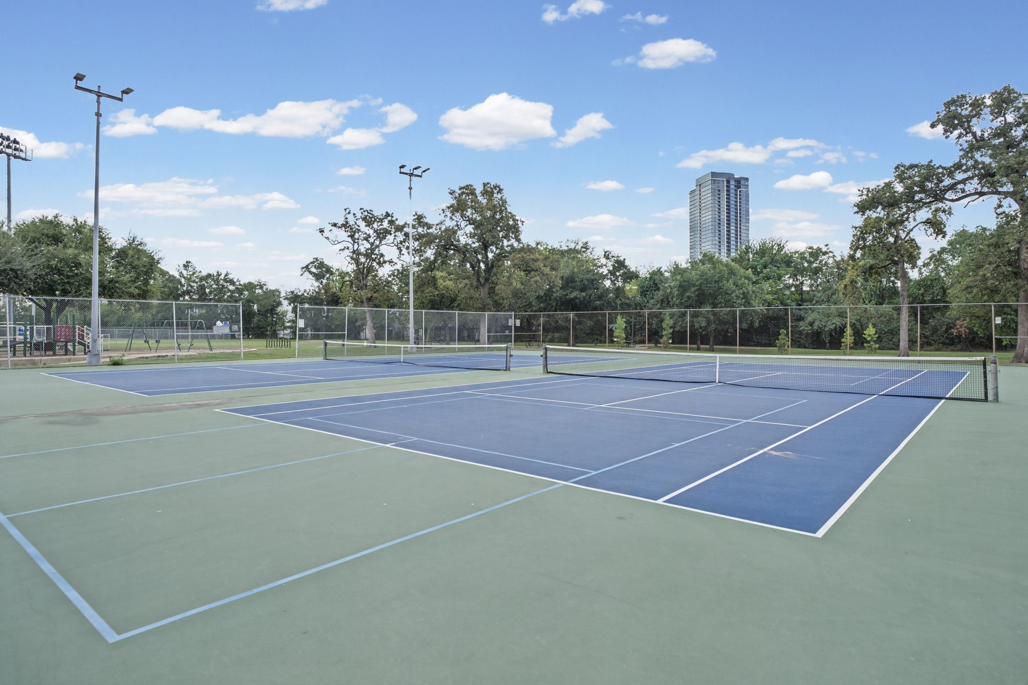 Cleveland Park | Tennis Courts  A neighborhood amenity worth celebrating. Enjoy the convenience of nearby tennis courts at Cleveland Park, where an afternoon match or a leisurely weekend rally is just a short stroll from your front door.