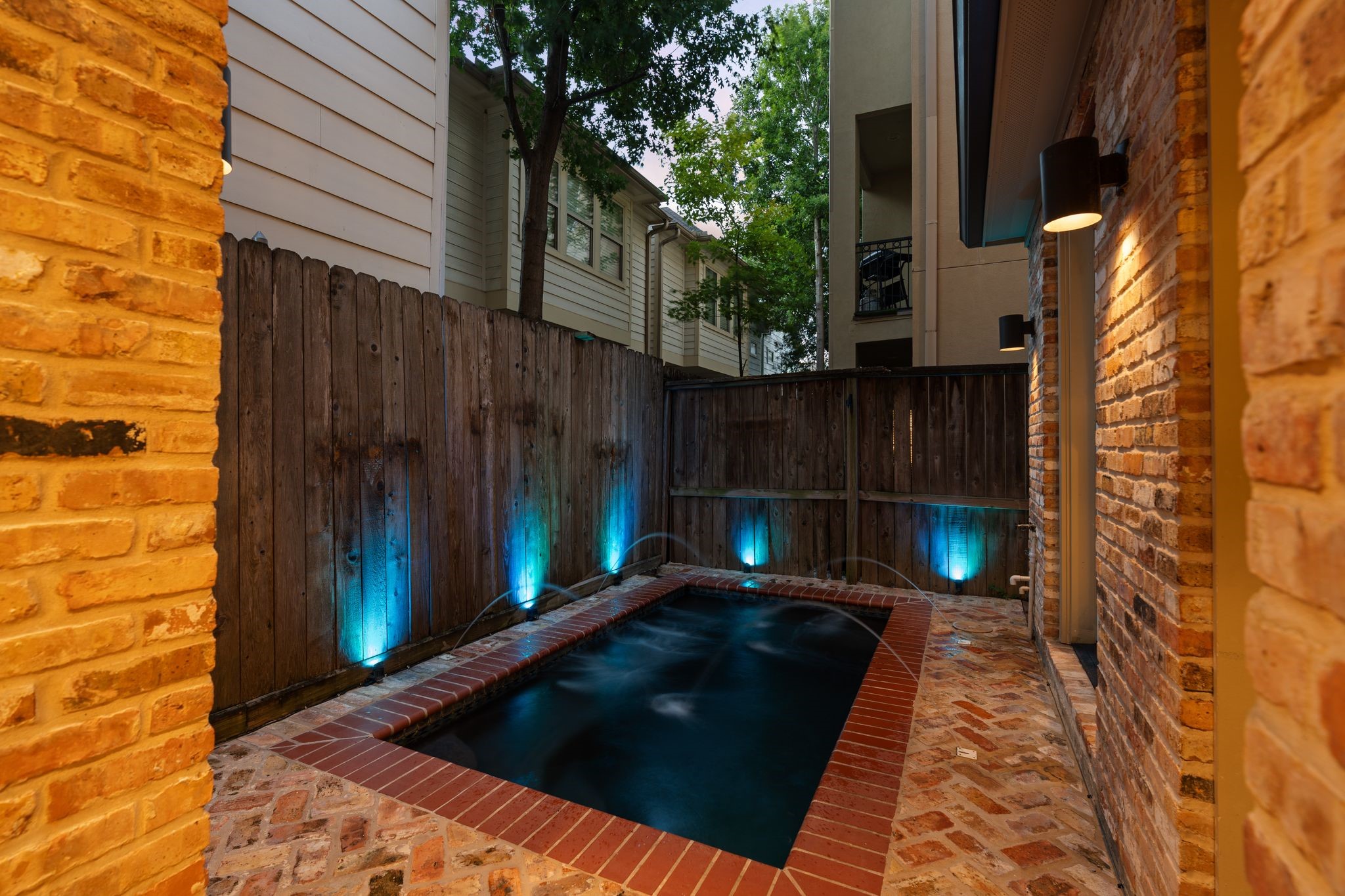 Private Plunge Pool | Outdoor Living  A little slice of Mediterranean living in the middle of Houston. Whether enjoying a refreshing evening dip or gathering with friends around the adjoining summer kitchen, this intimate outdoor retreat makes every day feel a little more like a getaway.